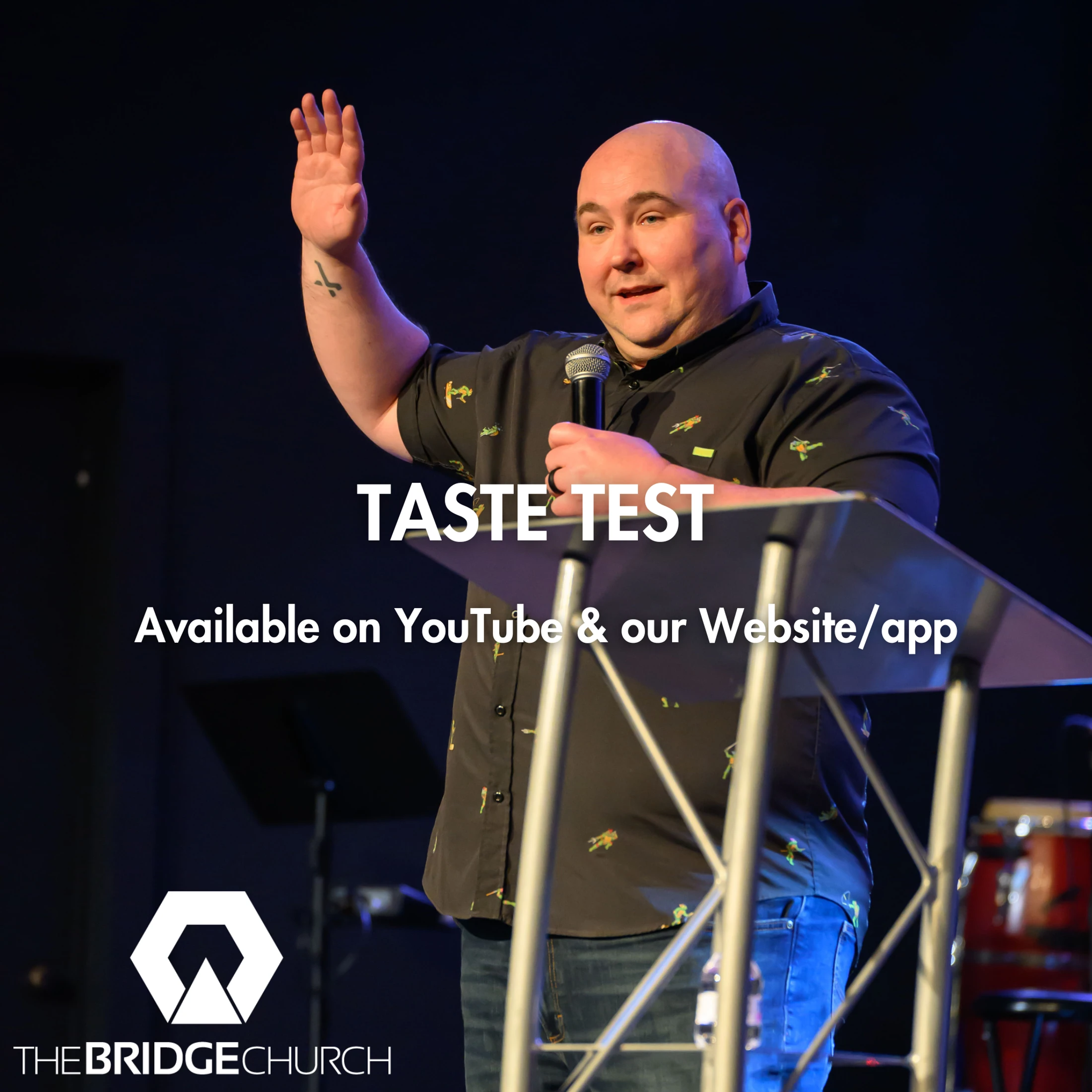 A man speaks at a lectern for The Bridge Church's sermon series 'Taste Test.' He holds a microphone and has one hand raised.
