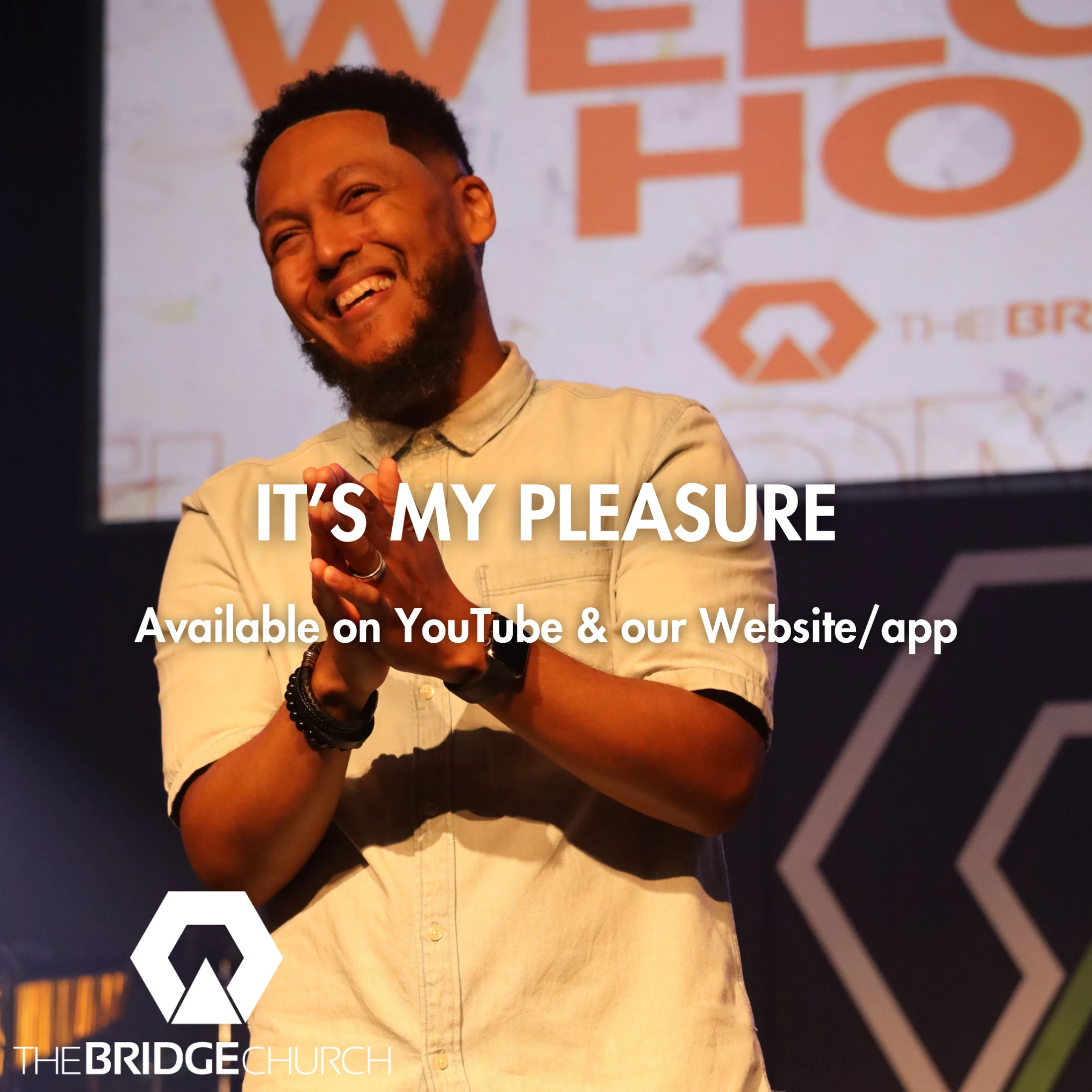A smiling man on stage at The Bridge Church, clapping. Text overlay reads 'It's My Pleasure. Available on YouTube & our Website/app.'