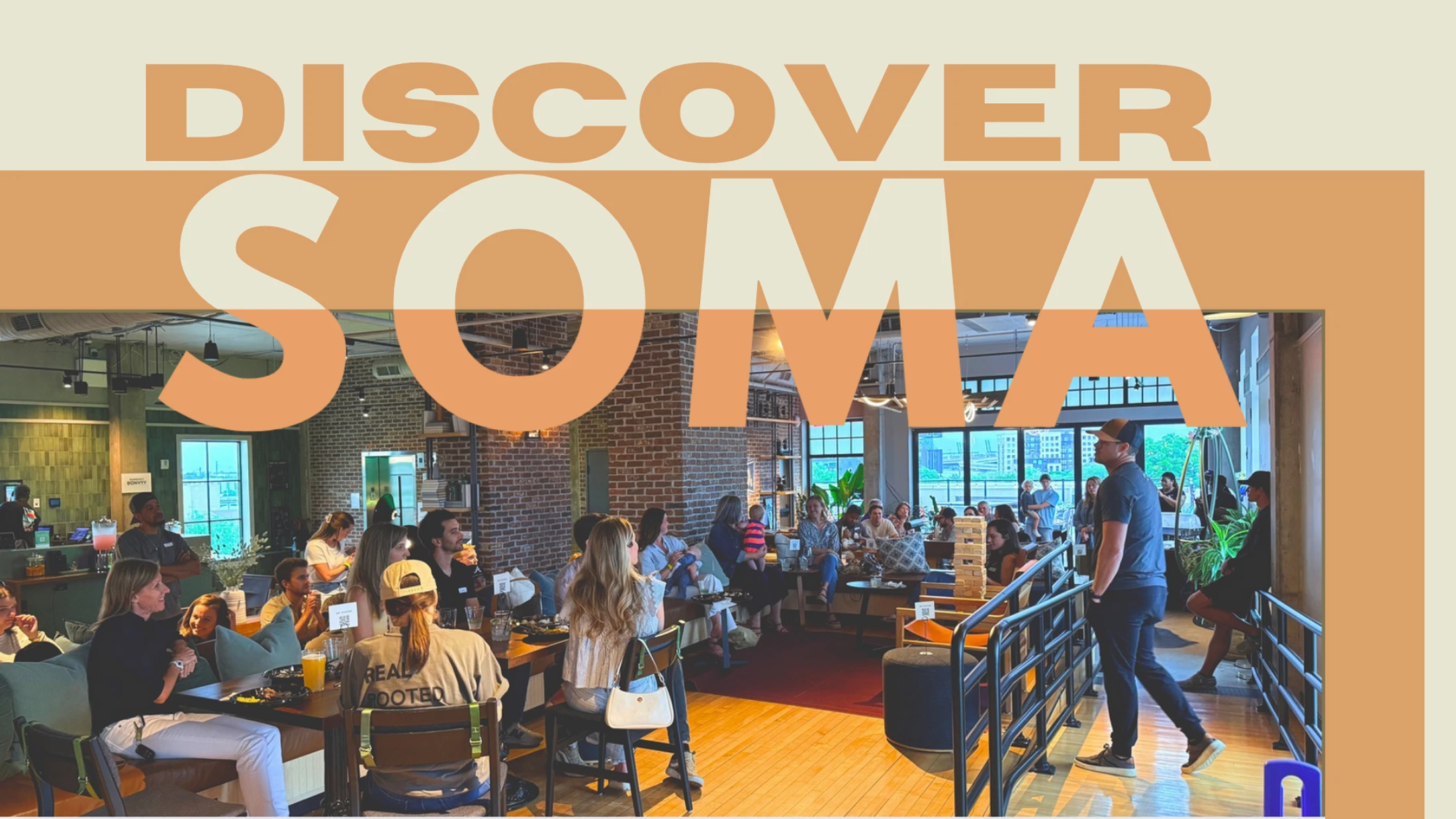A promotional image with the text 'Discover Soma' over a photo of people socializing in a modern, sunlit event space with brick walls and large windows.
