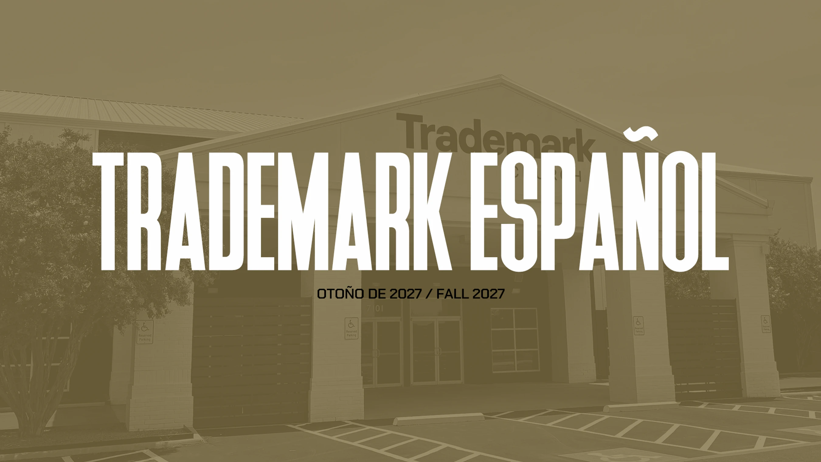 A sepia-toned image of the Trademark building with large white text overlaid that reads 'TRADEMARK ESPAÑOL' and 'OTOÑO DE 2027 / FALL 2027'.