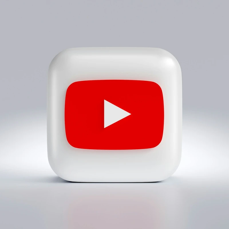 a white square button with a red arrow on it
