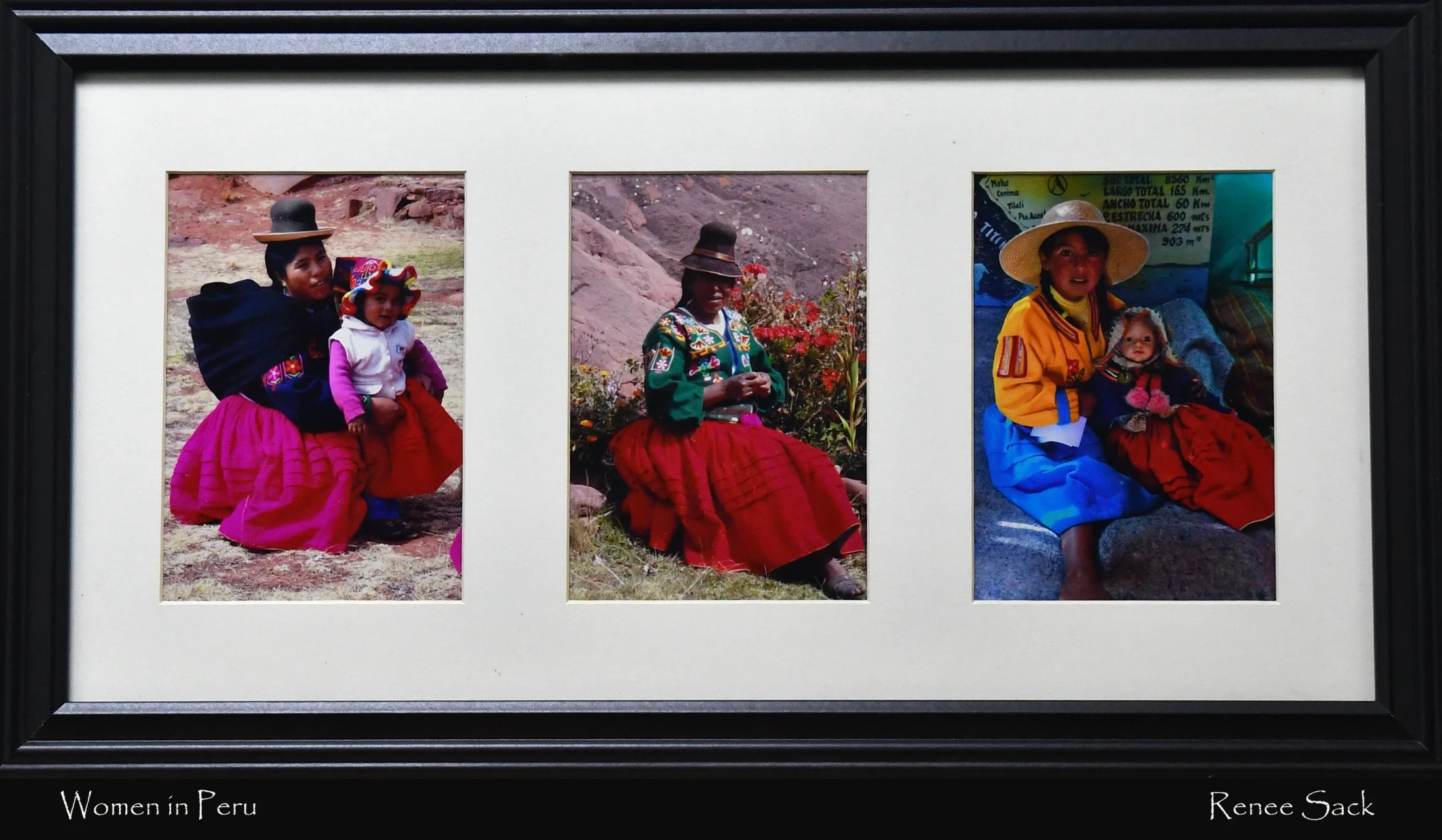 A black frame with a white mat holds three vertical photos of Peruvian women and children wearing colorful, traditional clothing in outdoor settings.