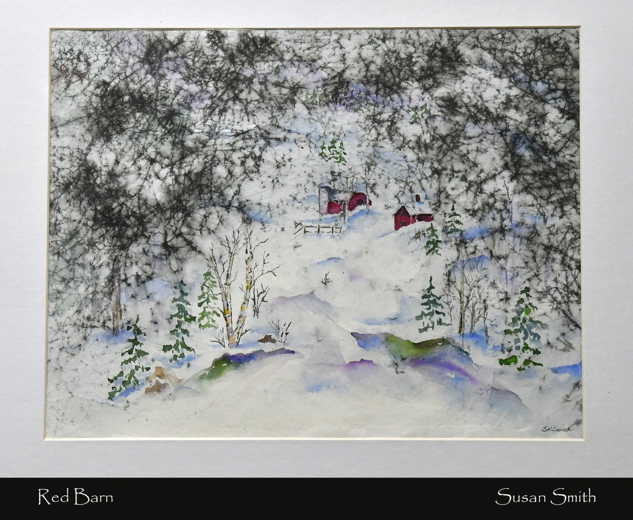 A batik and watercolor painting of a winter scene. A small red barn sits on a snow-covered hill surrounded by bare trees with a crackled, dark sky.