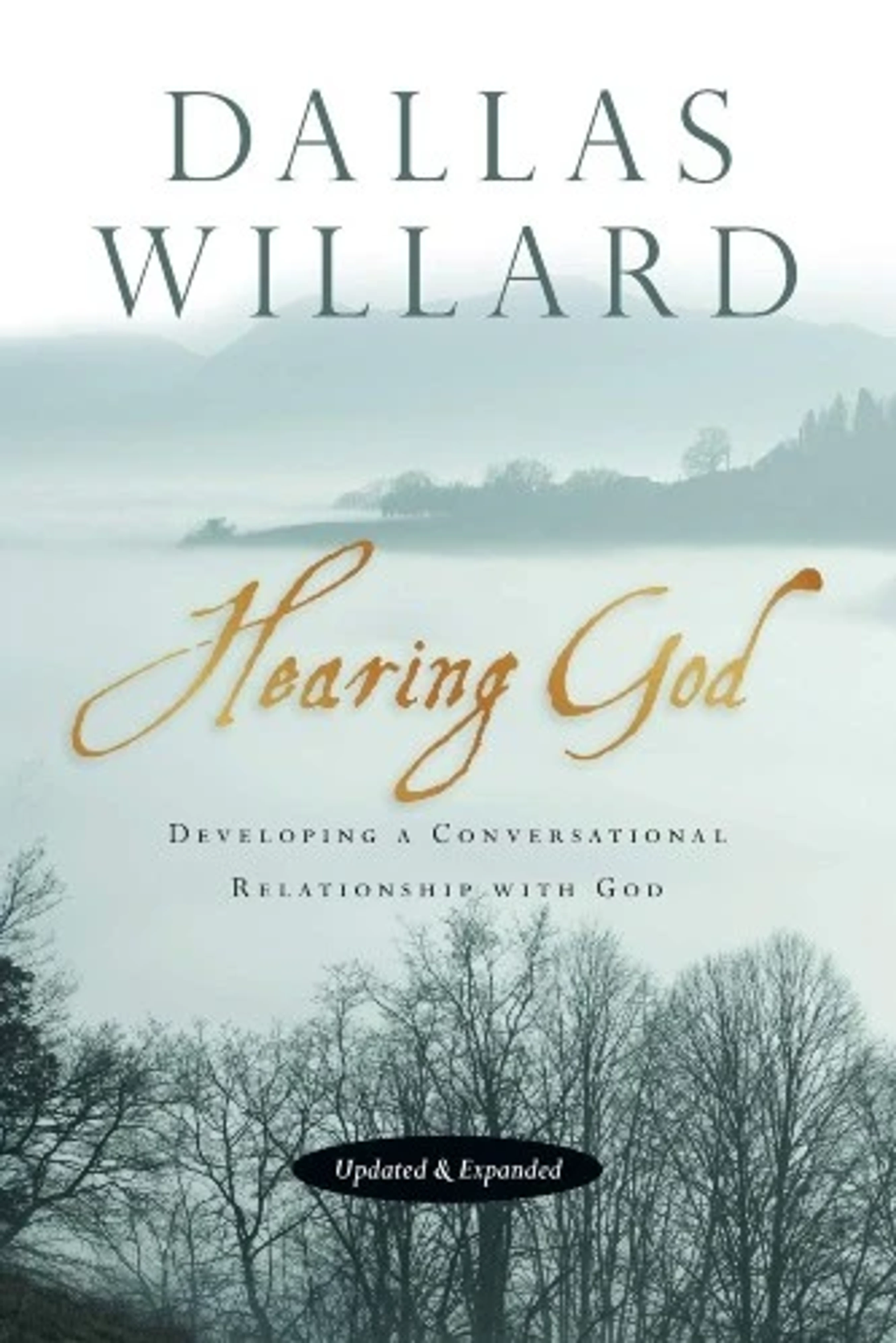 The cover of the book "Hearing God" by Dallas Willard, featuring a serene, misty landscape of hills and bare trees with gold script for the title.