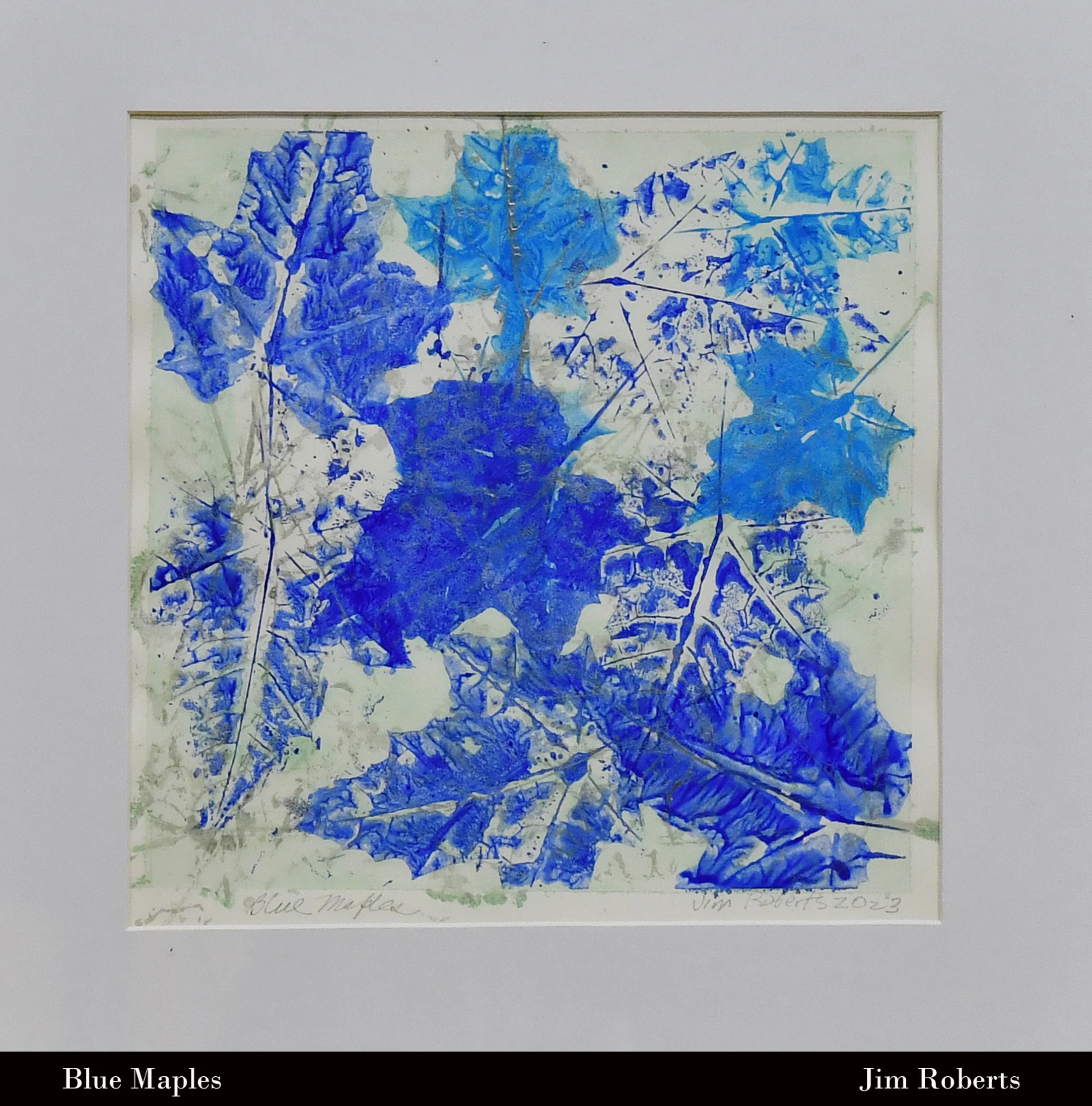 An abstract monoprint by Jim Roberts featuring overlapping blue impressions of maple leaves on a light green and white textured background, matted in white.