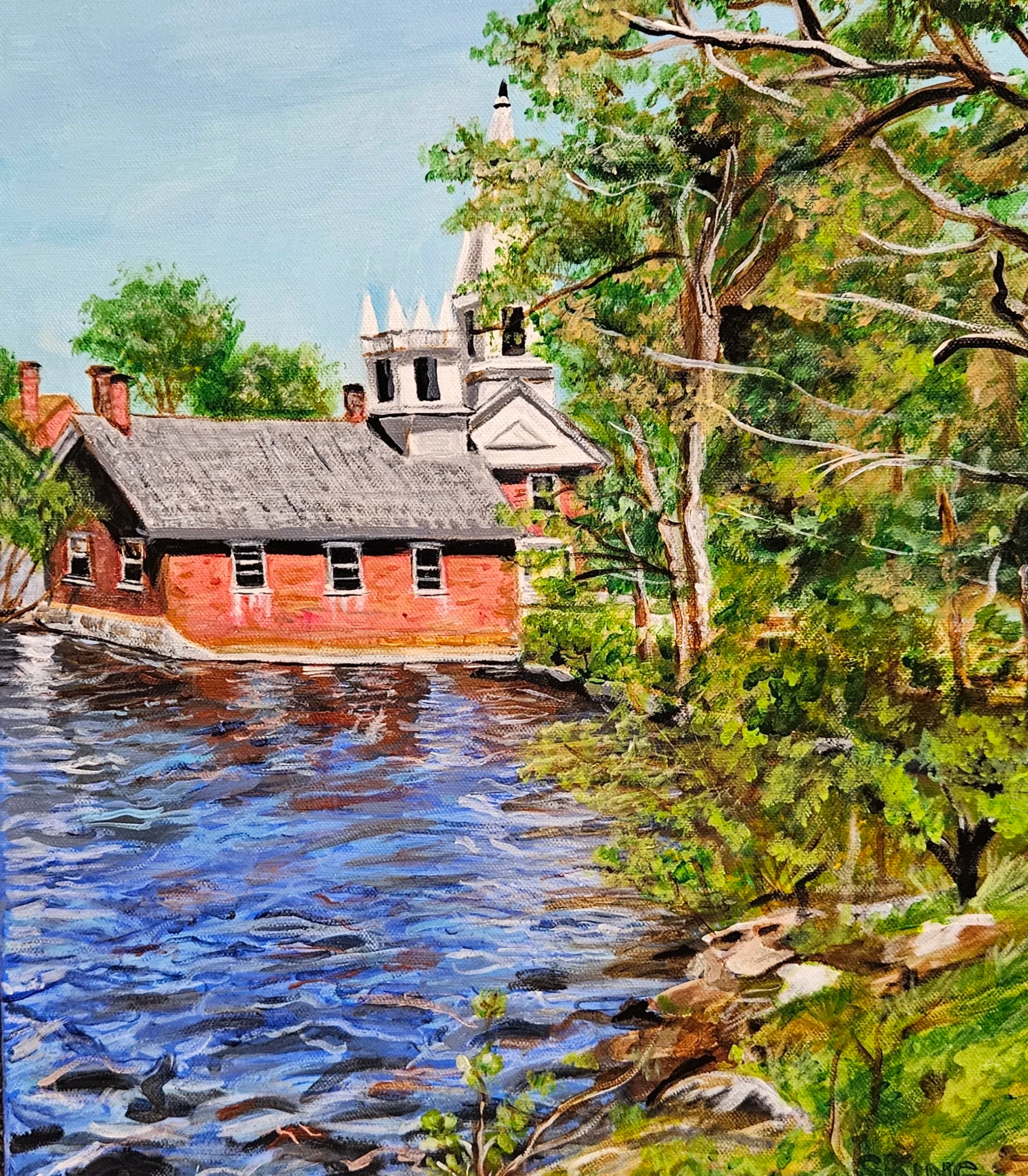 A colorful painting of a red brick building on the edge of a blue river. A white church steeple and lush green trees are visible in the background.