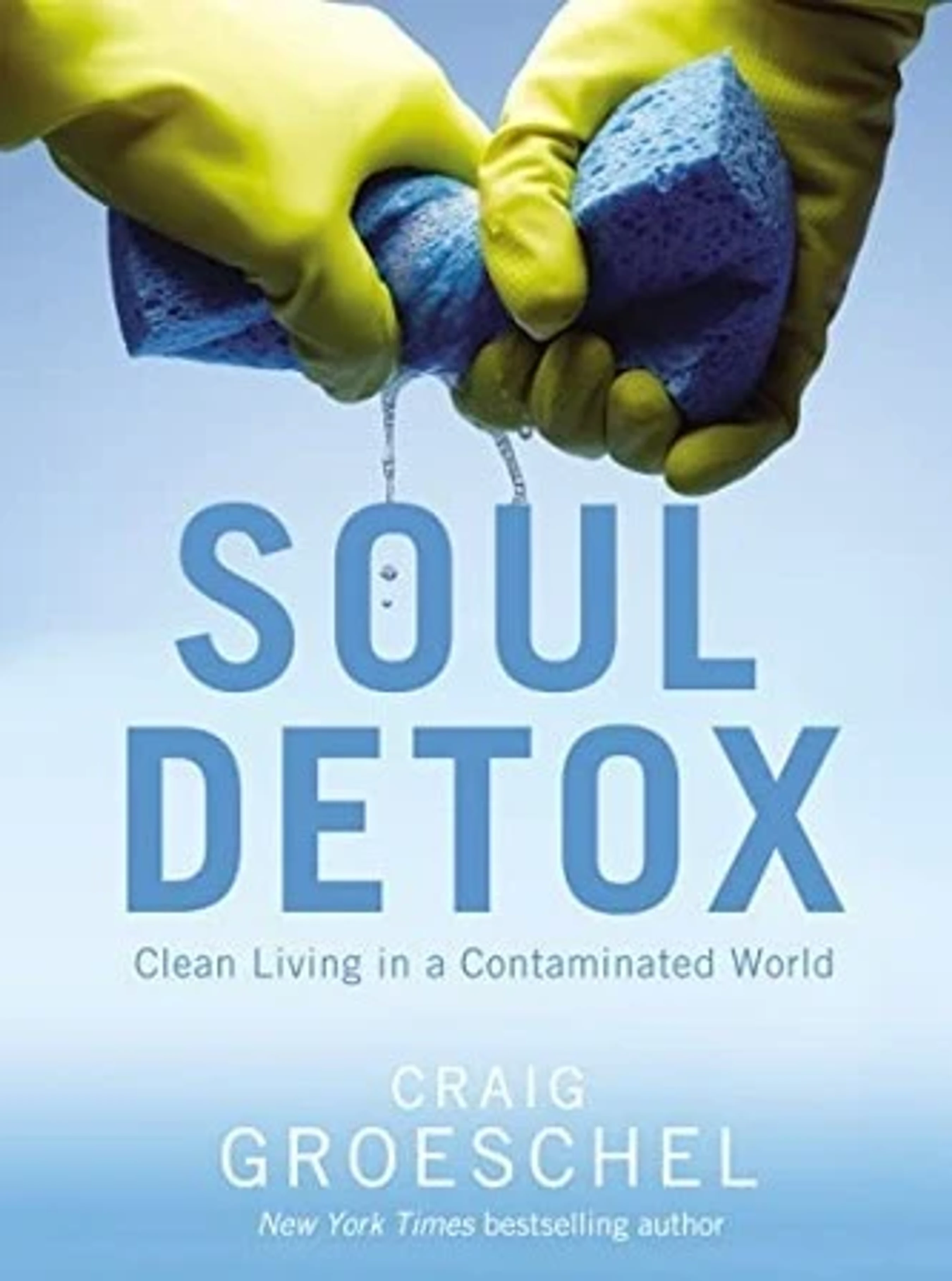 The cover of the book Soul Detox, featuring hands in yellow rubber gloves wringing out a blue sponge, symbolizing a spiritual cleansing.