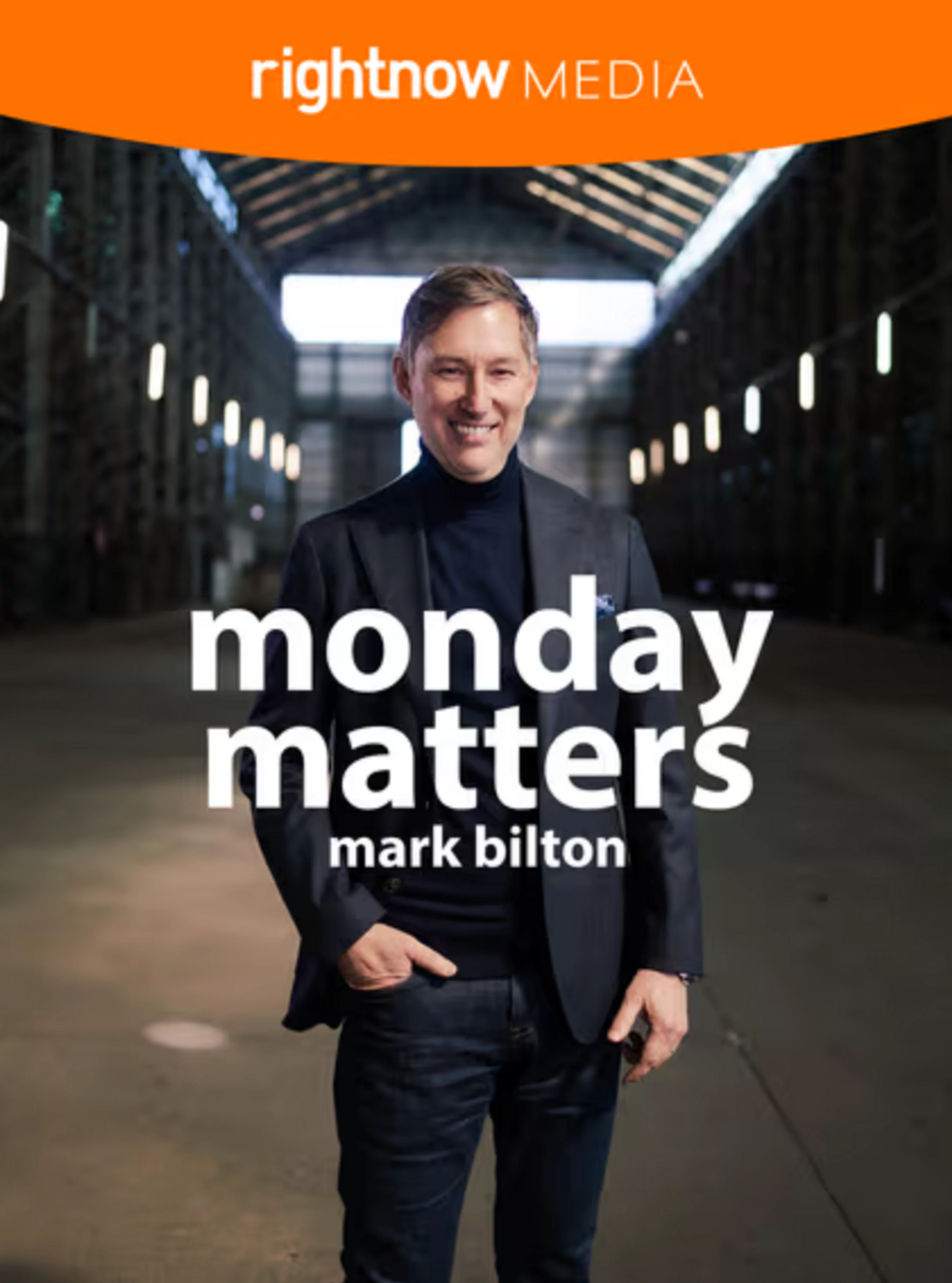 A smiling Mark Bilton stands in a warehouse on the cover of his RightNow Media series, 'Monday Matters'.