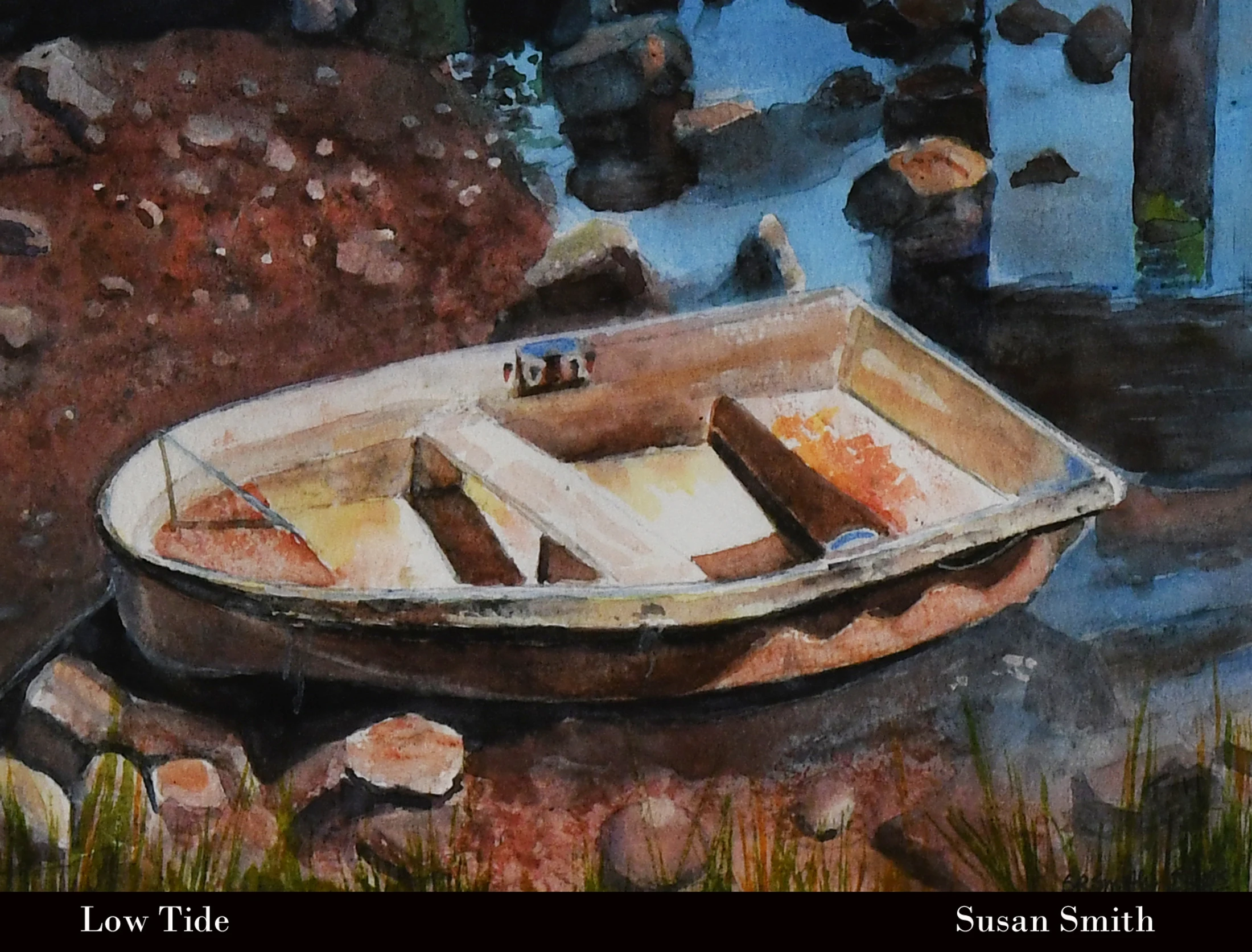 A watercolor painting of a small, empty rowboat resting on a rocky, reddish-brown shore during low tide, with calm blue water nearby.