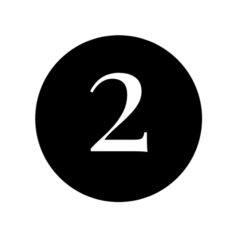A white number two in a serif font is displayed inside a solid black circle on a white background.