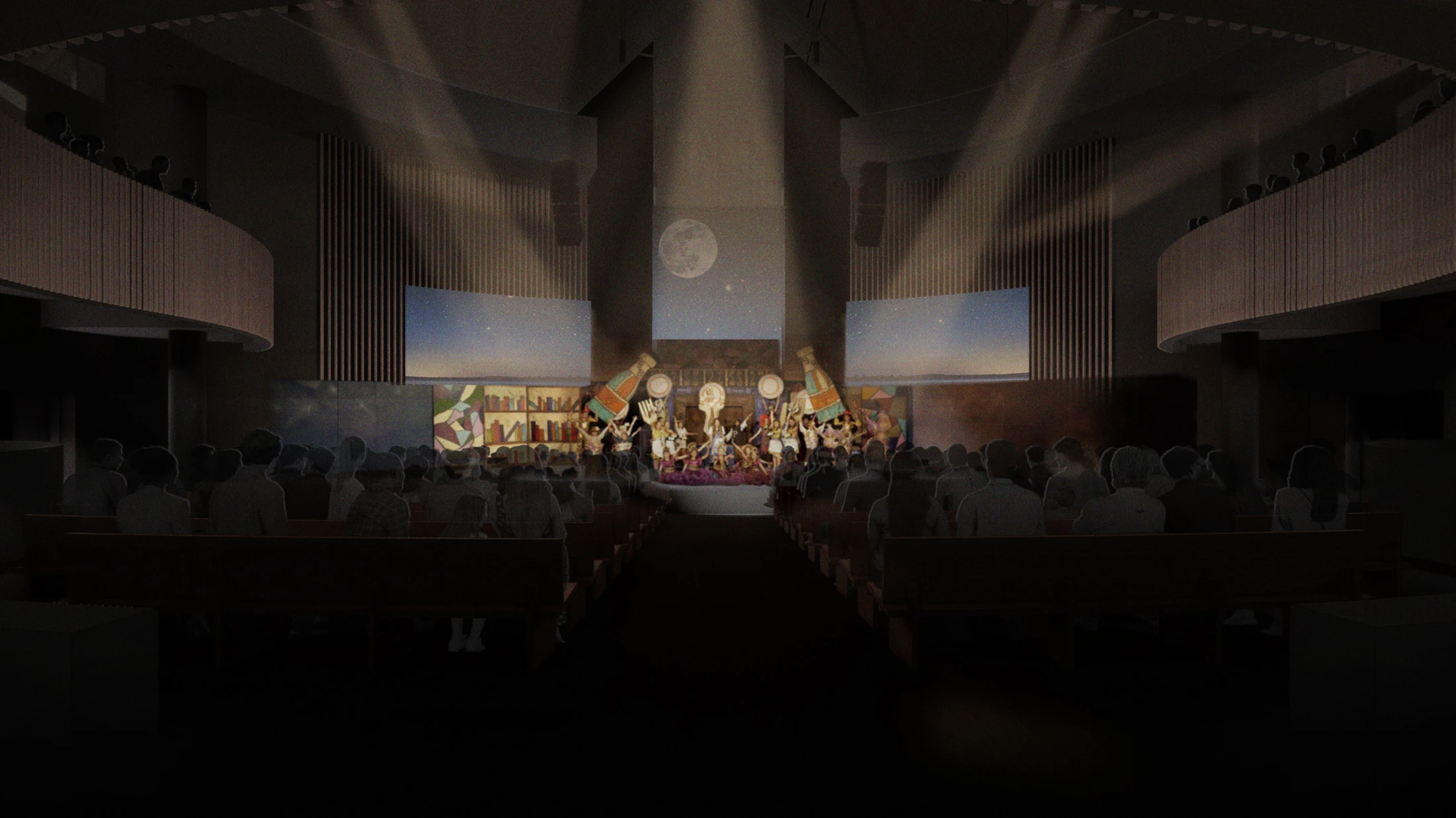 A view from the back of a dark auditorium looking towards a brightly lit stage where performers in colorful costumes are dancing under spotlights.