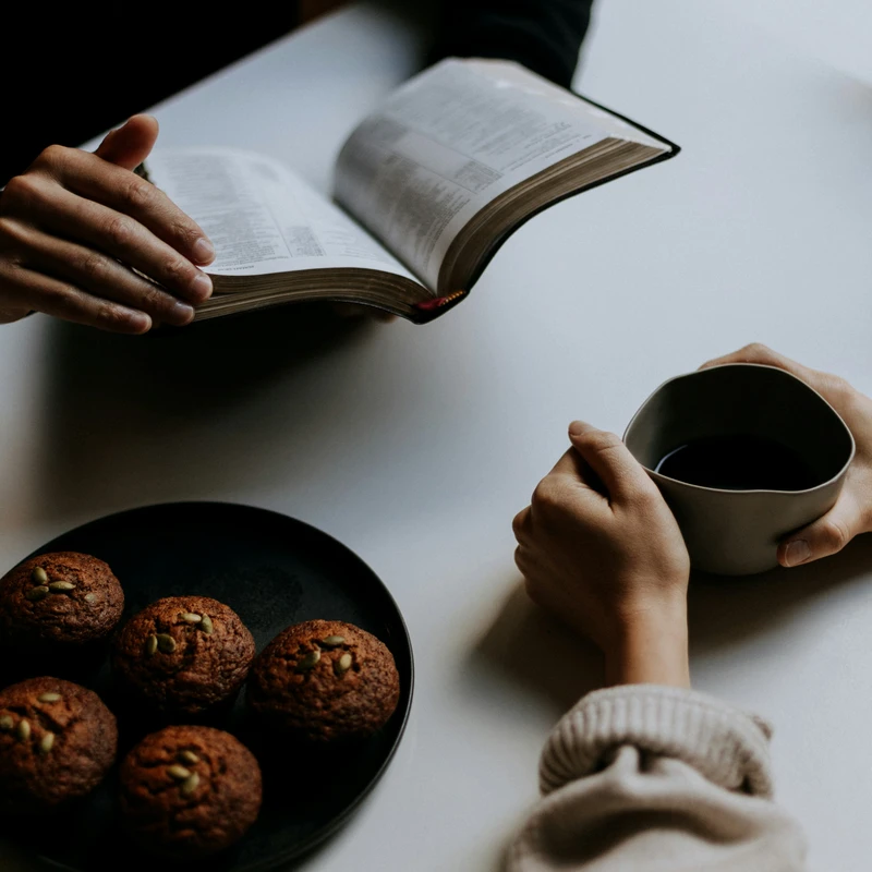 person holding white ceramic mug with coffee