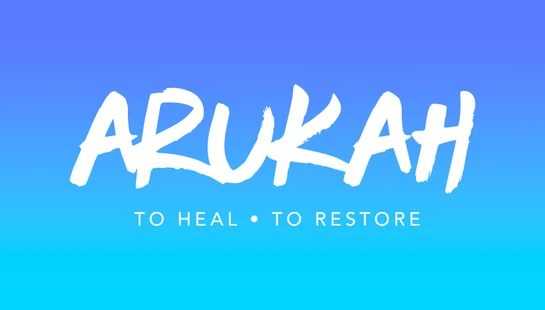 The word 'ARUKAH' in a white brush script font on a blue to turquoise gradient background, with 'TO HEAL • TO RESTORE' written below.