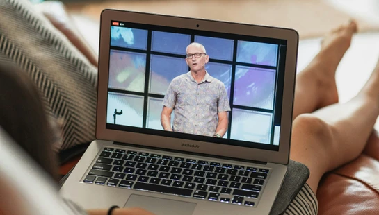 macbook pro on persons lap