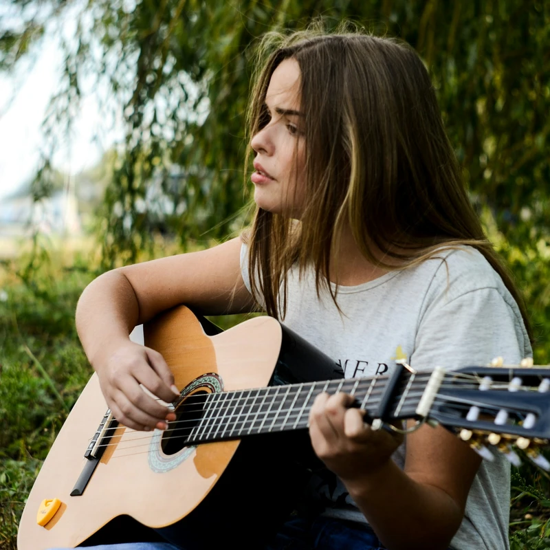 woman playing gitar