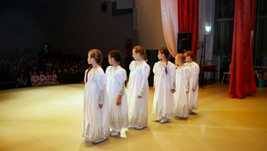 a group of women in white dresses
