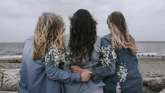 2 women in blue denim jacket