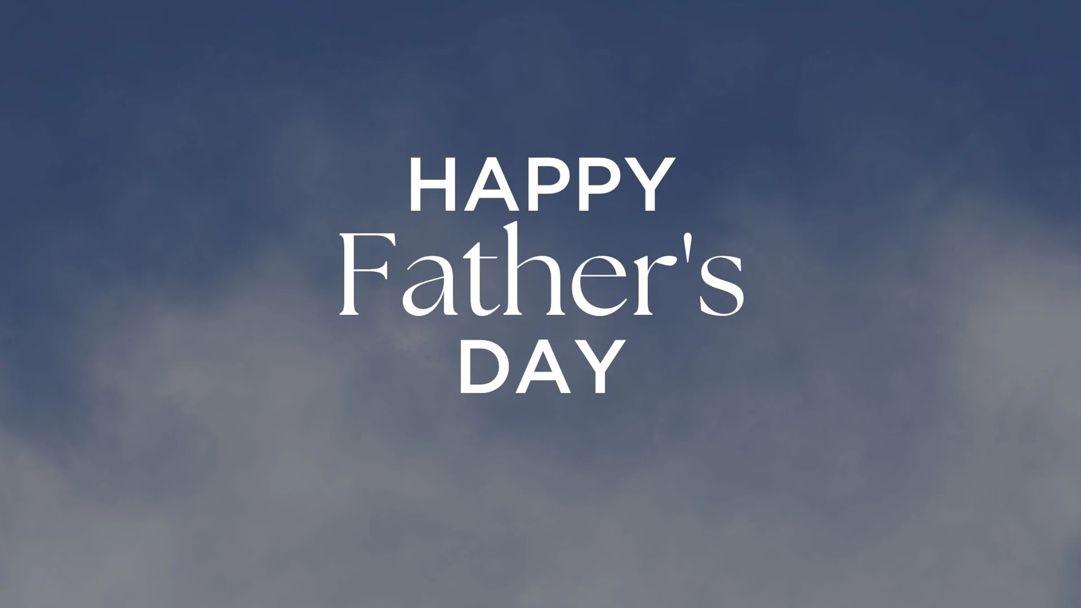 The words "Happy Father's Day" in white serif text are centered over a background image of a soft, cloudy blue and grey sky.