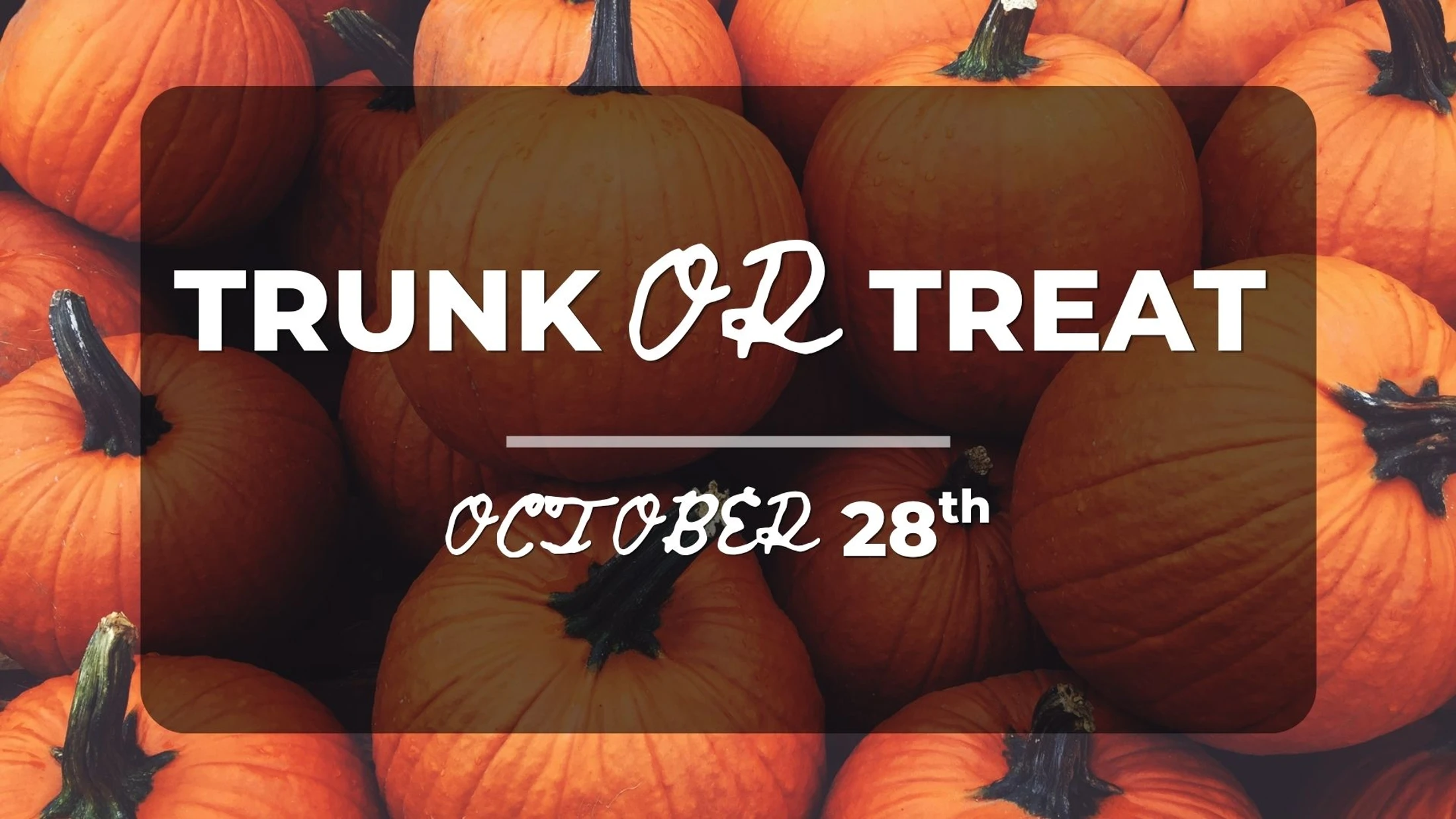 An event graphic for Trunk or Treat on October 28th. The white text is overlaid on a background image of many bright orange pumpkins.