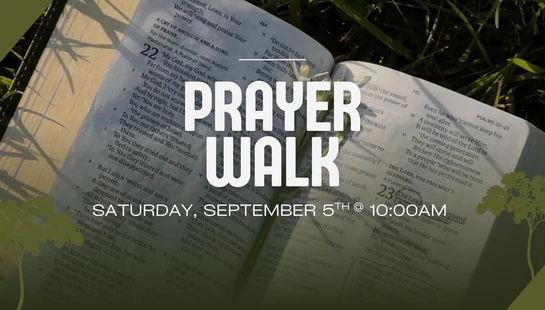 A graphic announcing a 'Prayer Walk' on Saturday, September 5th at 10 AM. The text is overlaid on a photo of an open Bible resting on green grass.