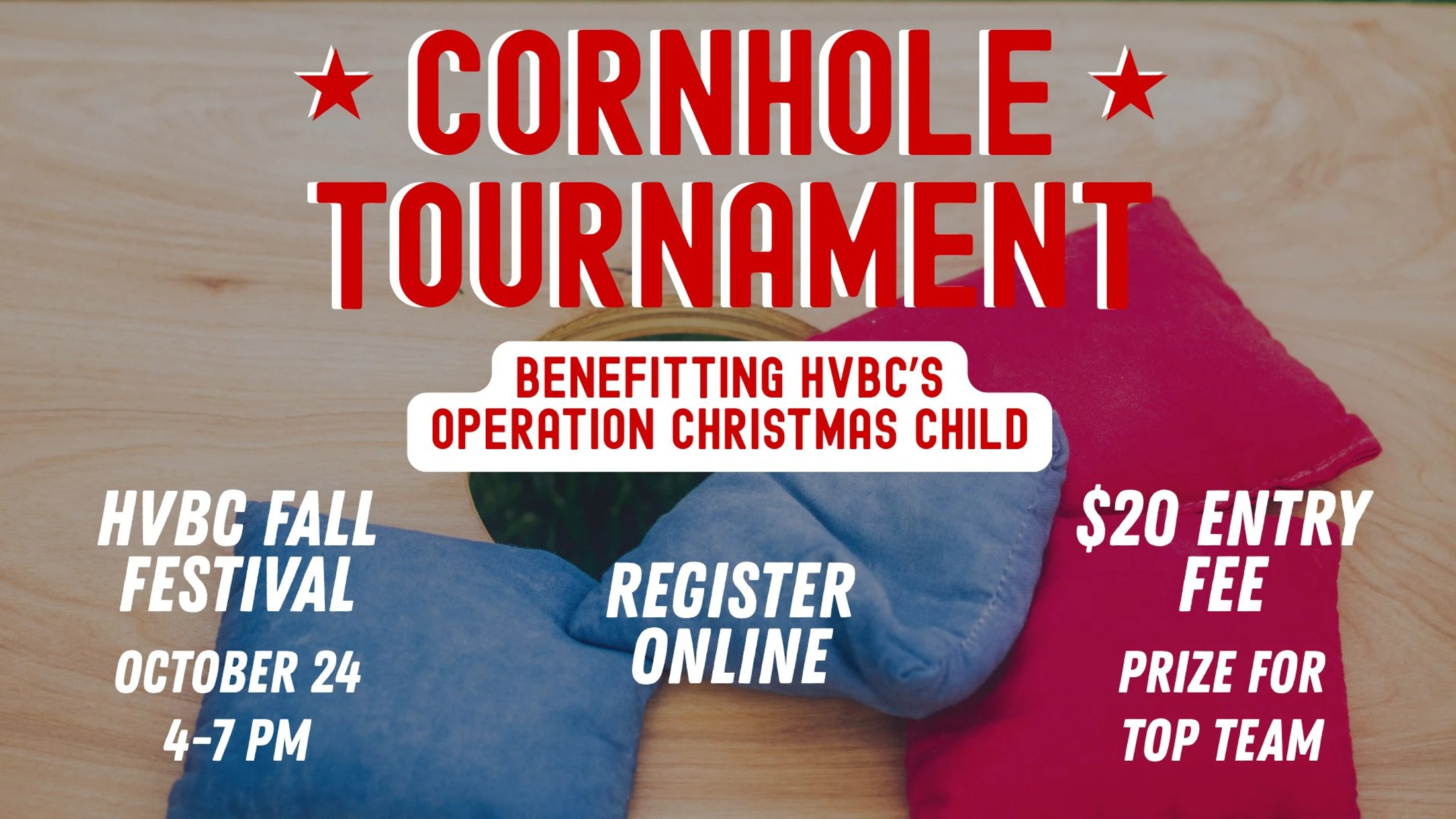 A graphic advertising a cornhole tournament for HVBC's Operation Christmas Child on October 24. A blue and red beanbag rest on a cornhole board.