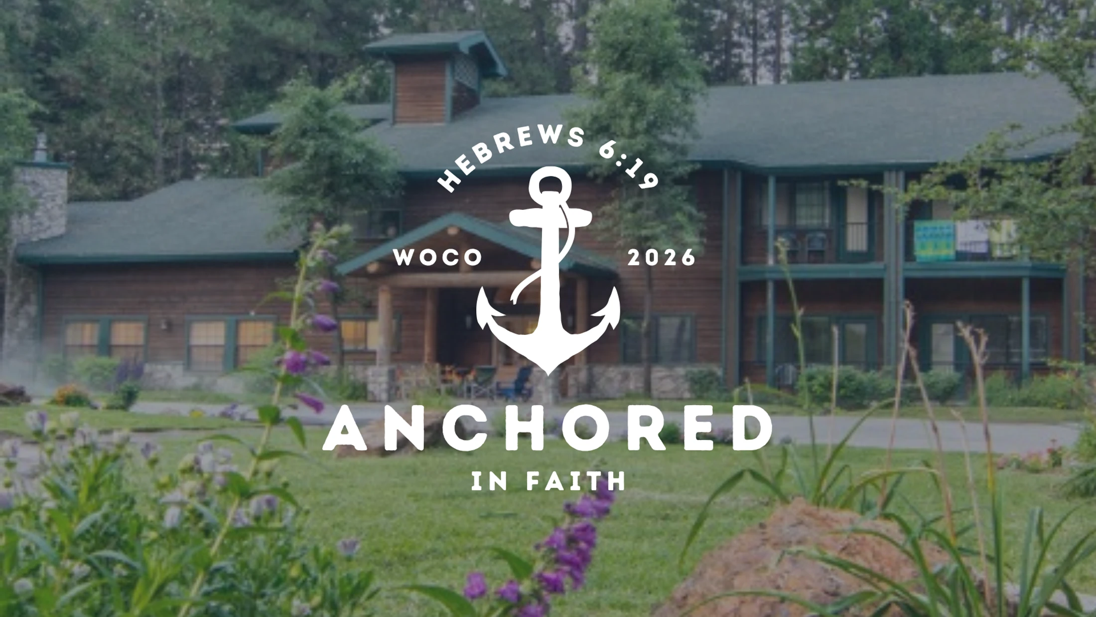 A rustic wooden lodge in a forest setting with a graphic overlay that reads 'Anchored in Faith' and 'Hebrews 6:19' with a large white anchor icon.
