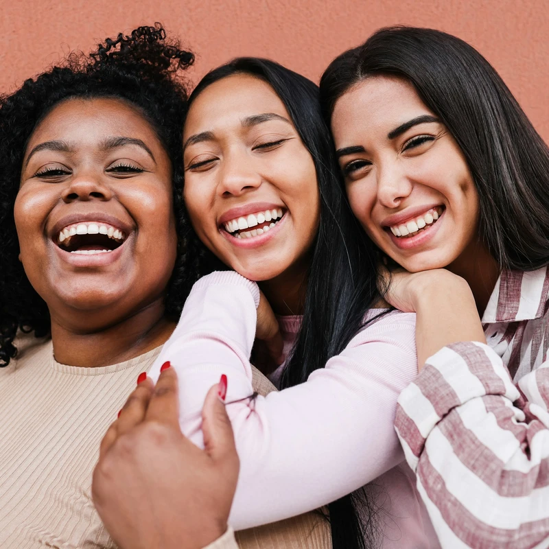 a group of women standing next to each other