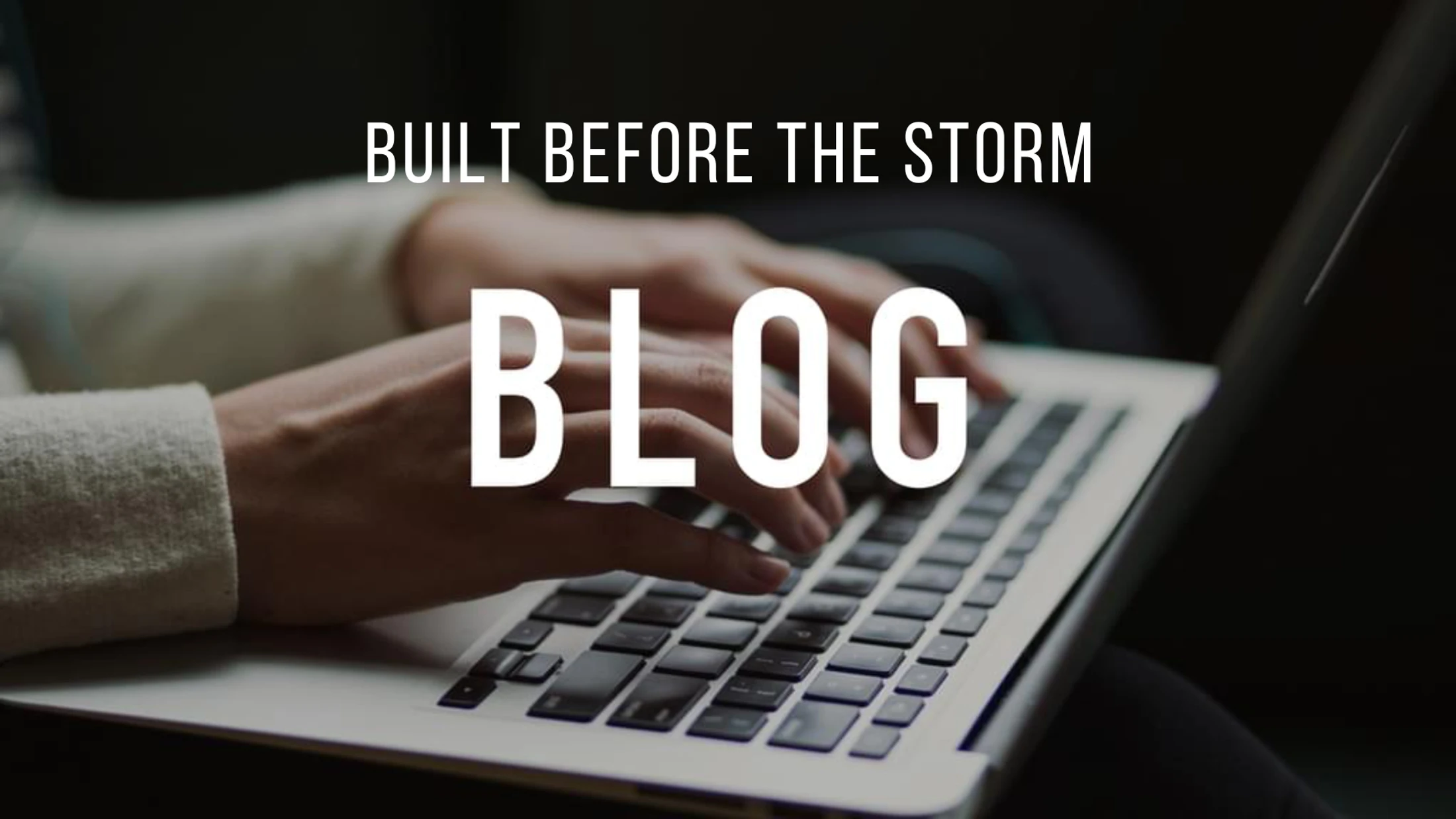 A close-up of a person's hands typing on a silver laptop. Text overlay reads 'Built Before The Storm Blog' in white letters.