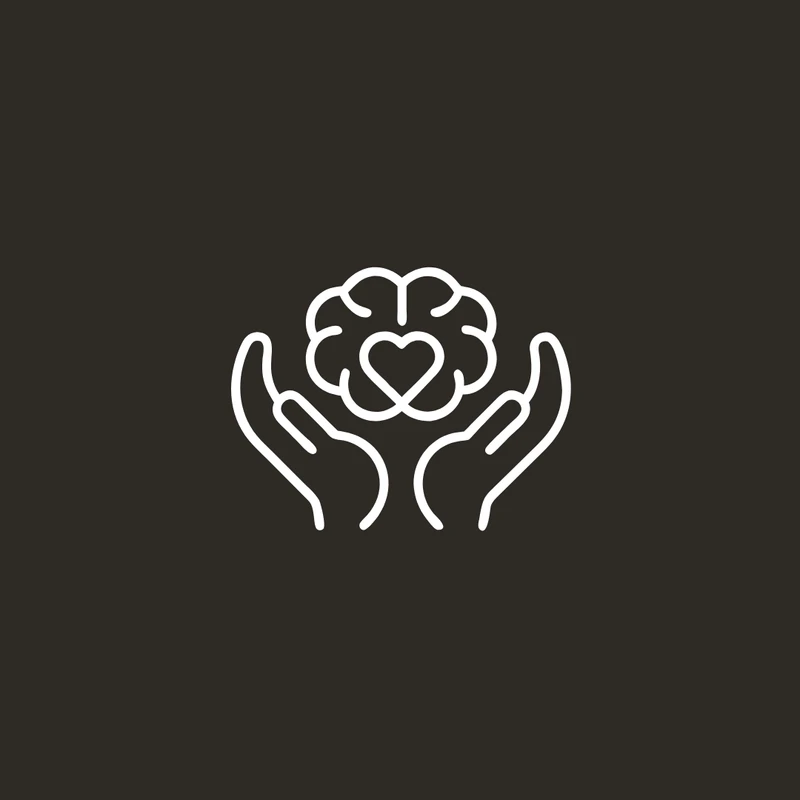 A white line icon of two hands holding a brain with a heart in the center, symbolizing mental health and emotional well-being, on a dark grey background.