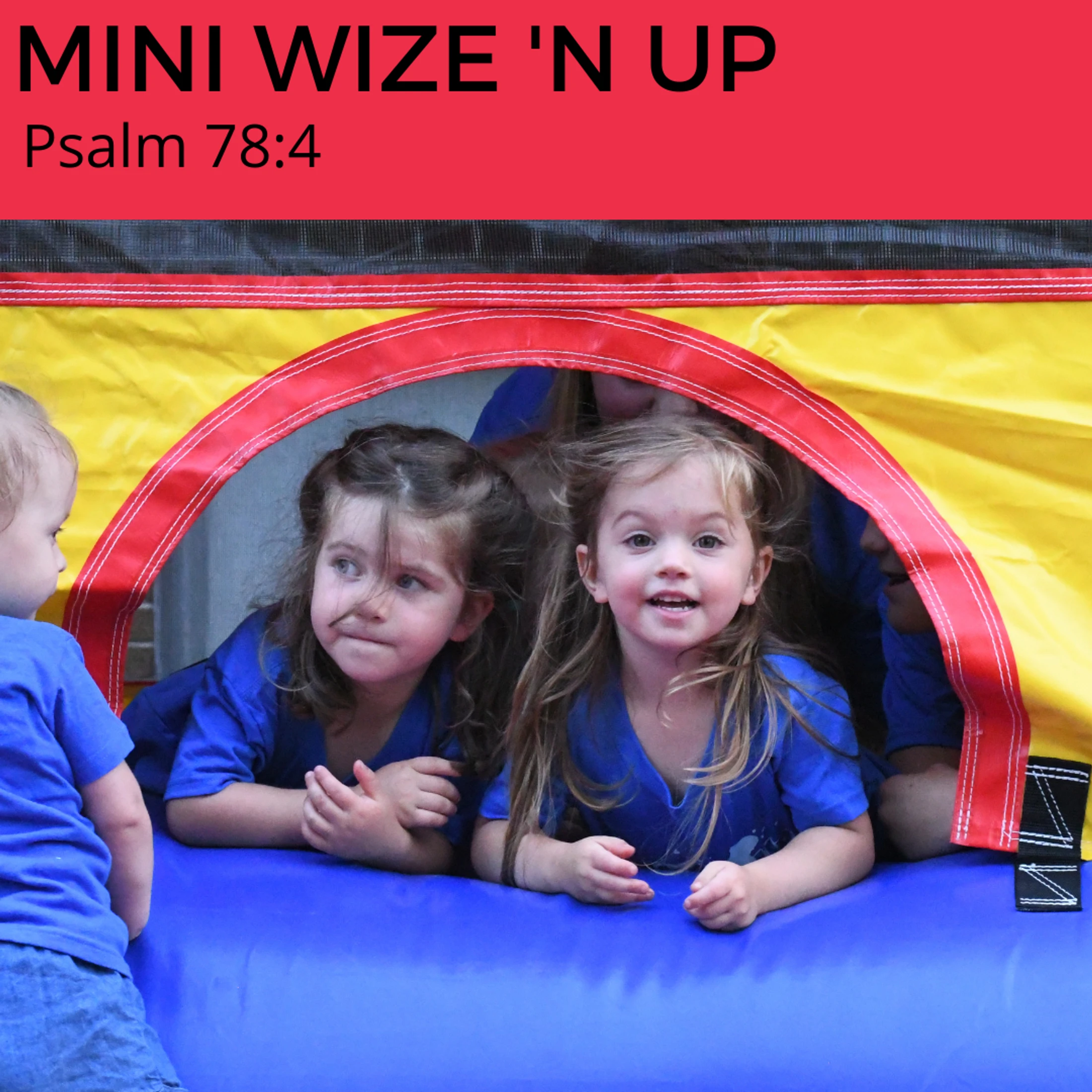 Two young girls in matching blue shirts look out the window of a colorful bounce house. A red banner at the top reads "MINI WIZE 'N UP Psalm 78:4".