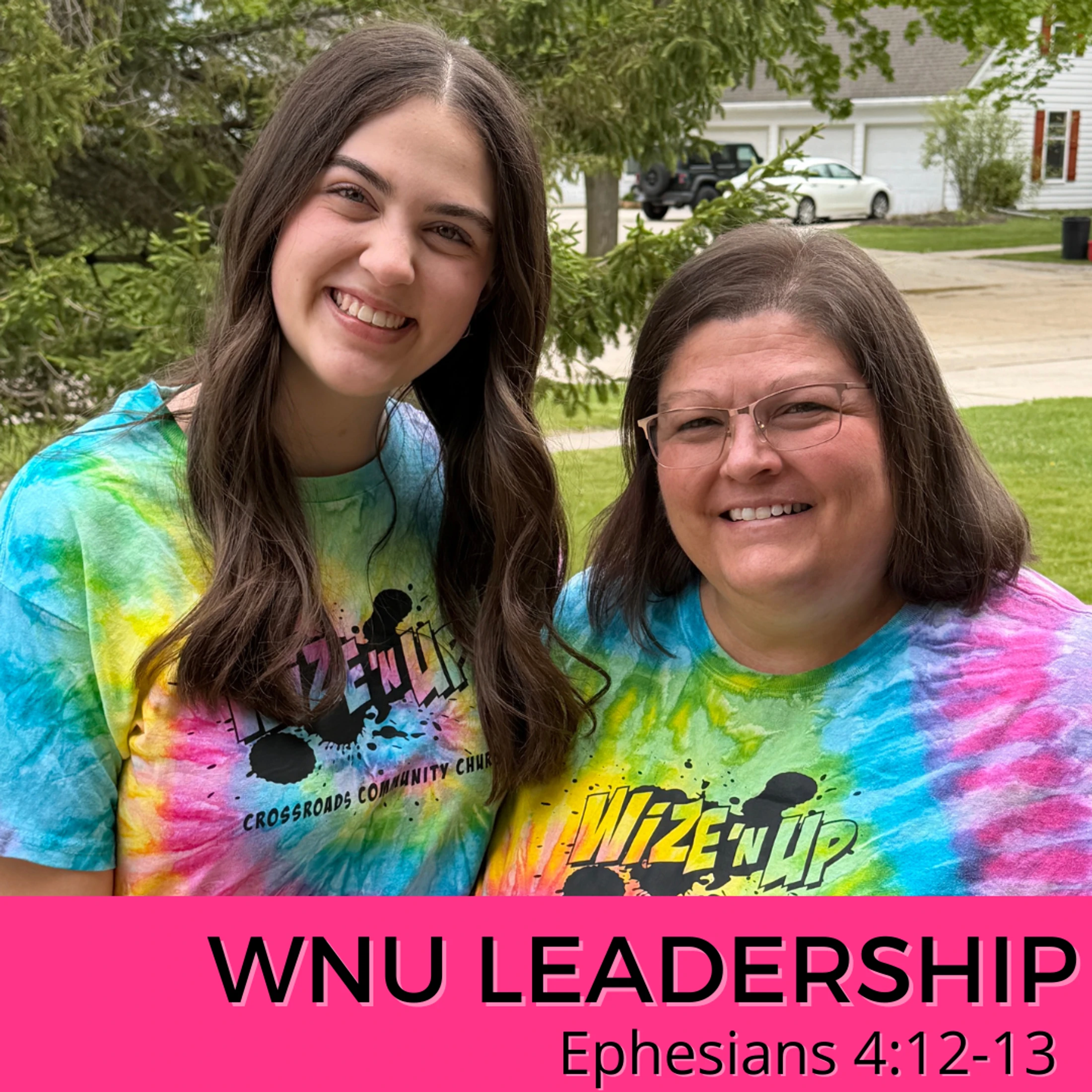 Two smiling women in matching colorful tie-dye shirts stand outside. A pink banner below reads 'WNU LEADERSHIP, Ephesians 4:12-13'.