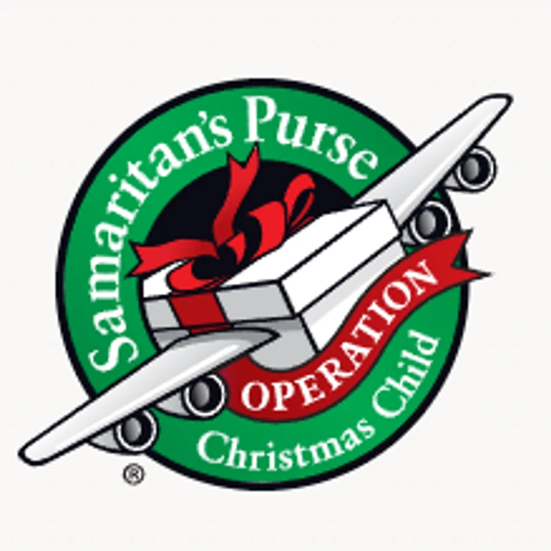 The logo for Samaritan's Purse Operation Christmas Child, showing a shoebox gift with airplane wings and a red bow inside a green circular emblem.