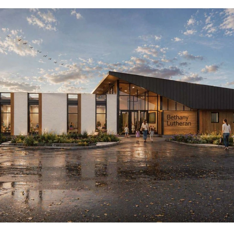 A rendering of the modern Bethany Lutheran church building at sunset. People are walking towards the glass entrance from a wet parking lot.