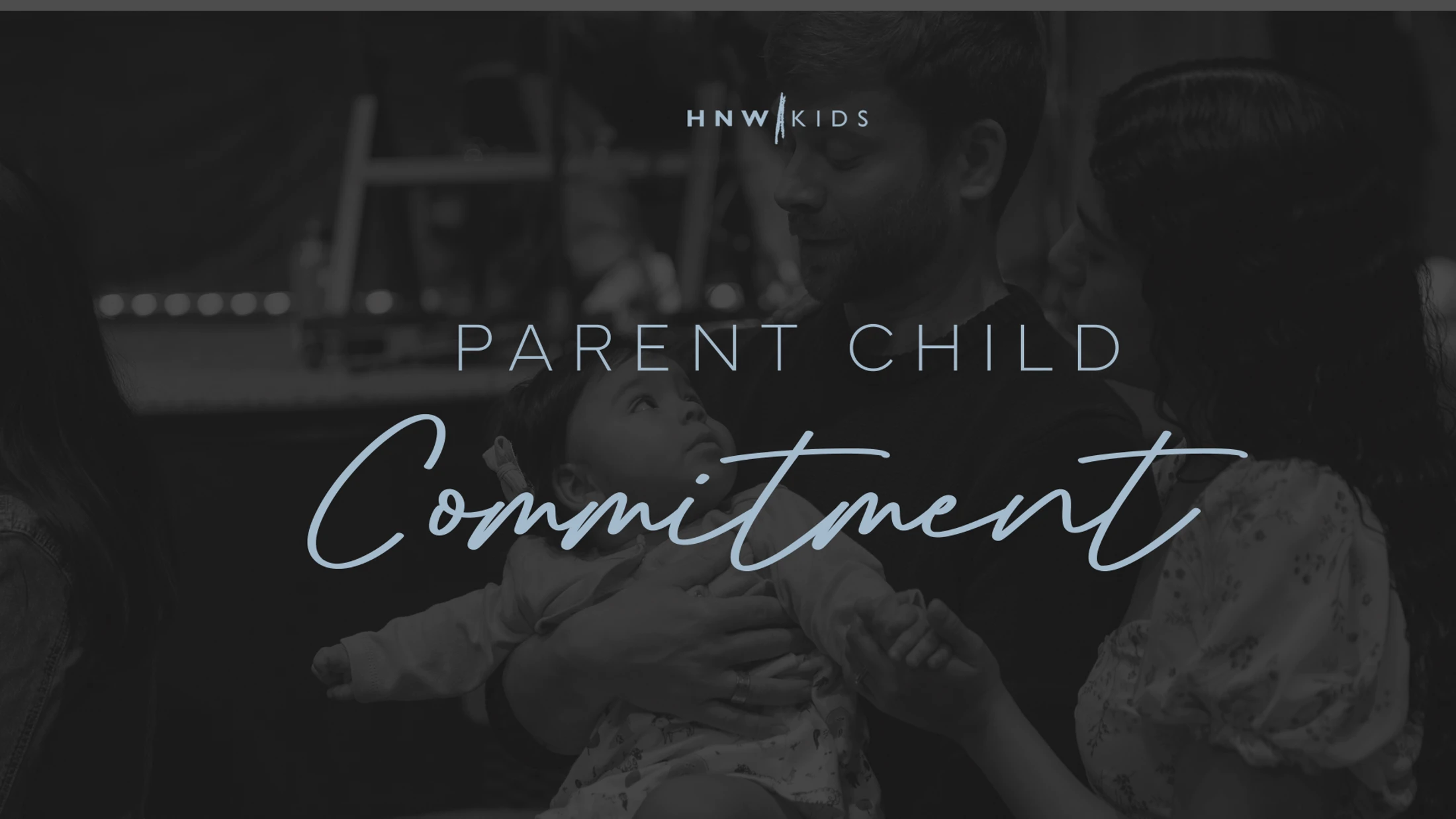 A father holds a baby while the mother stands close by. The image has a dark filter with text that reads 'Parent Child Commitment'.