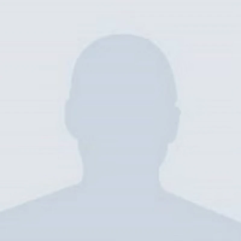 A gray silhouette of a person's head and shoulders against a light gray background, used as a generic placeholder for a user's profile picture.