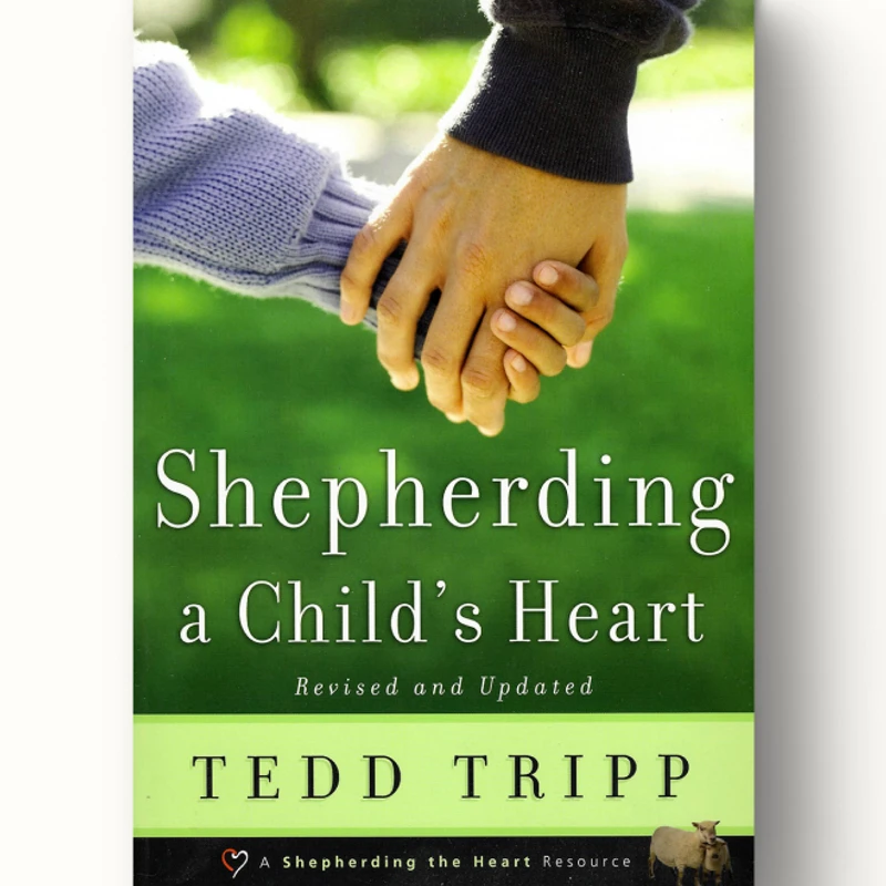The cover of the book 'Shepherding a Child's Heart' by Tedd Tripp, featuring an adult's hand holding a child's hand over a green grassy background.