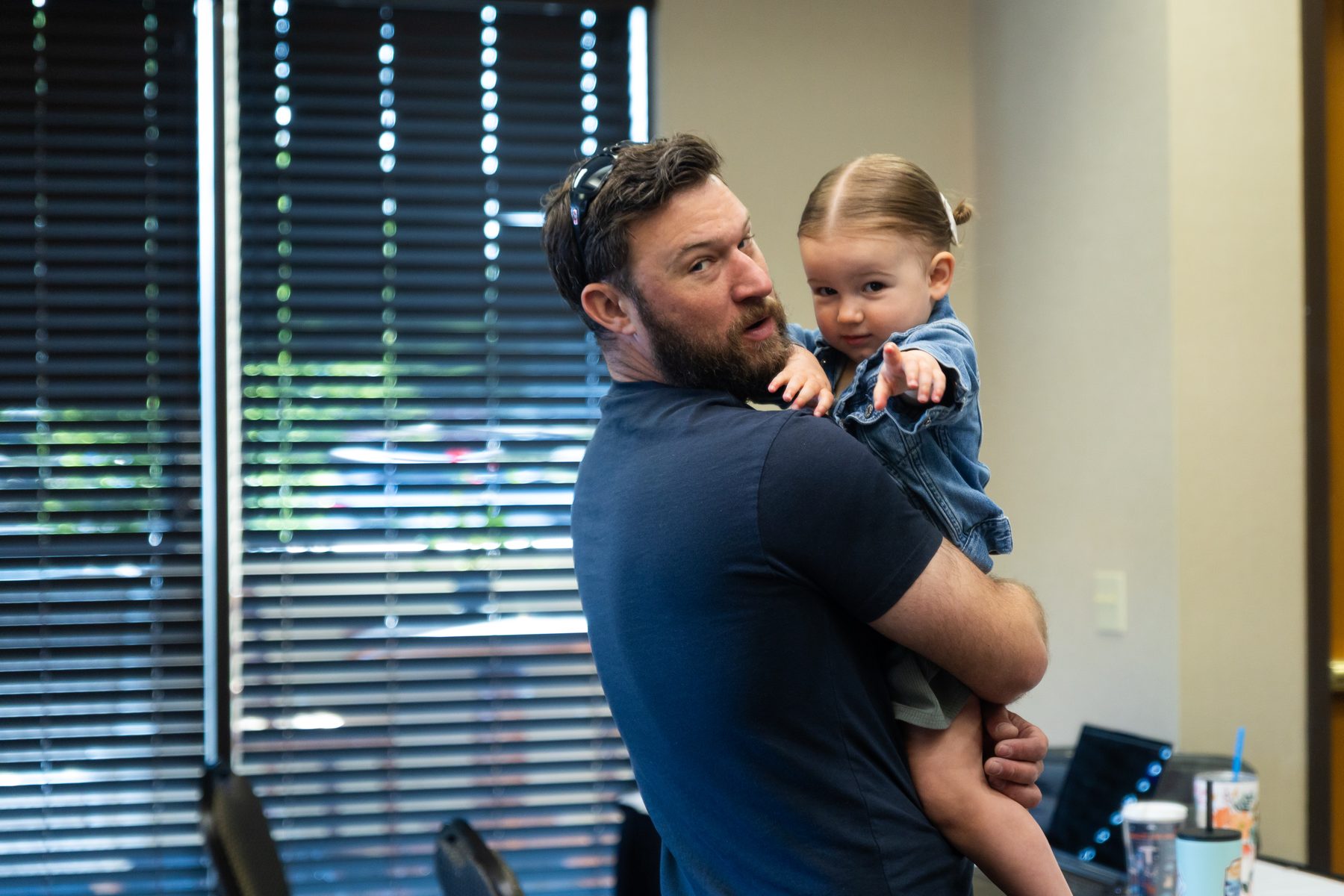 A dad holding his toddler at Lilac City Church