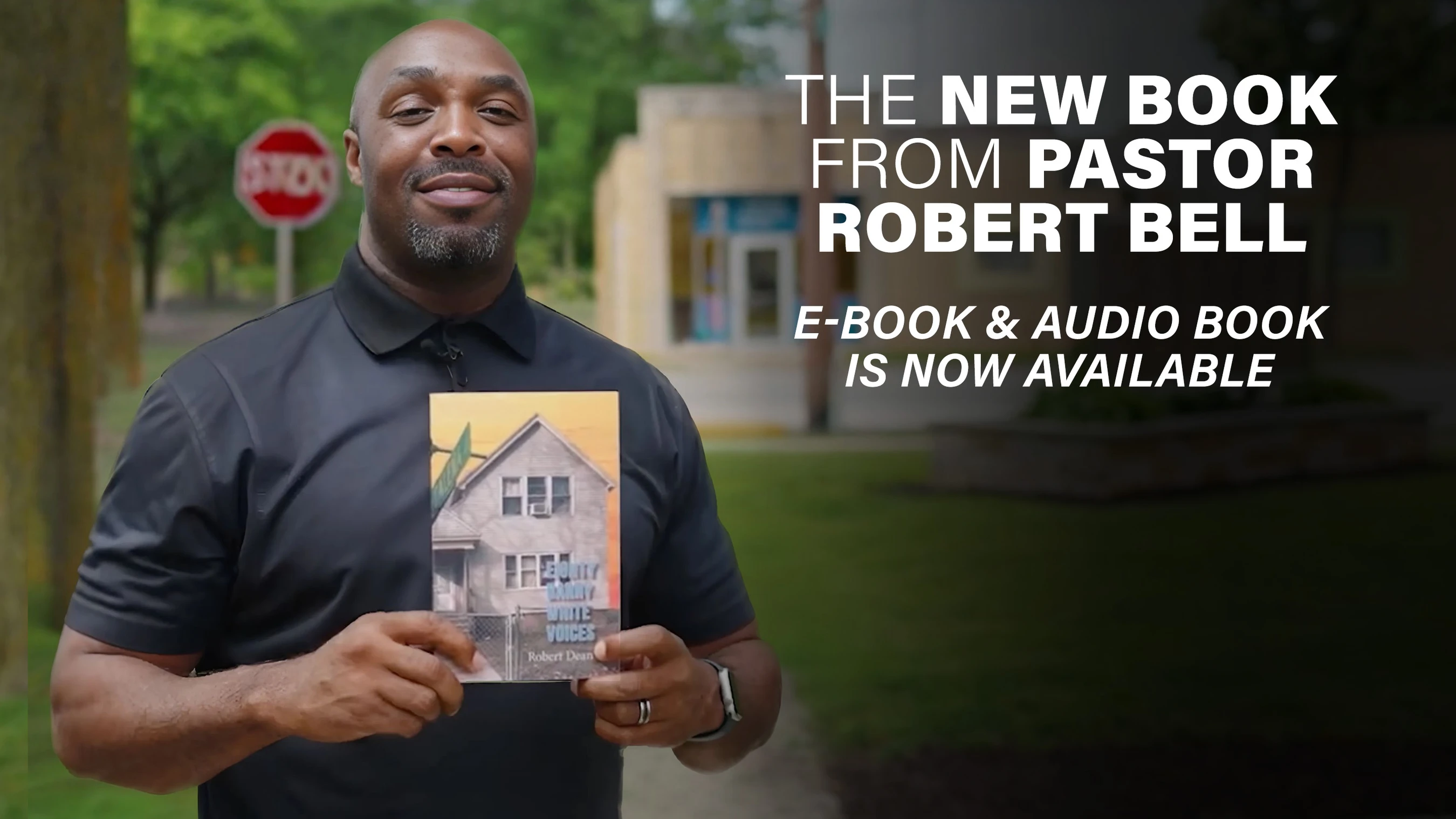 Pastor Robert Bell, a smiling Black man, stands outdoors holding his new book. Text announces the e-book and audio book are now available.