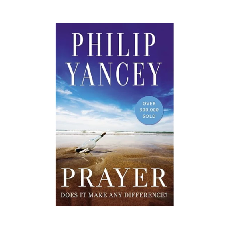 The cover of the book Prayer by Philip Yancey, which shows a message in a bottle washed up on a sandy beach under a blue sky.