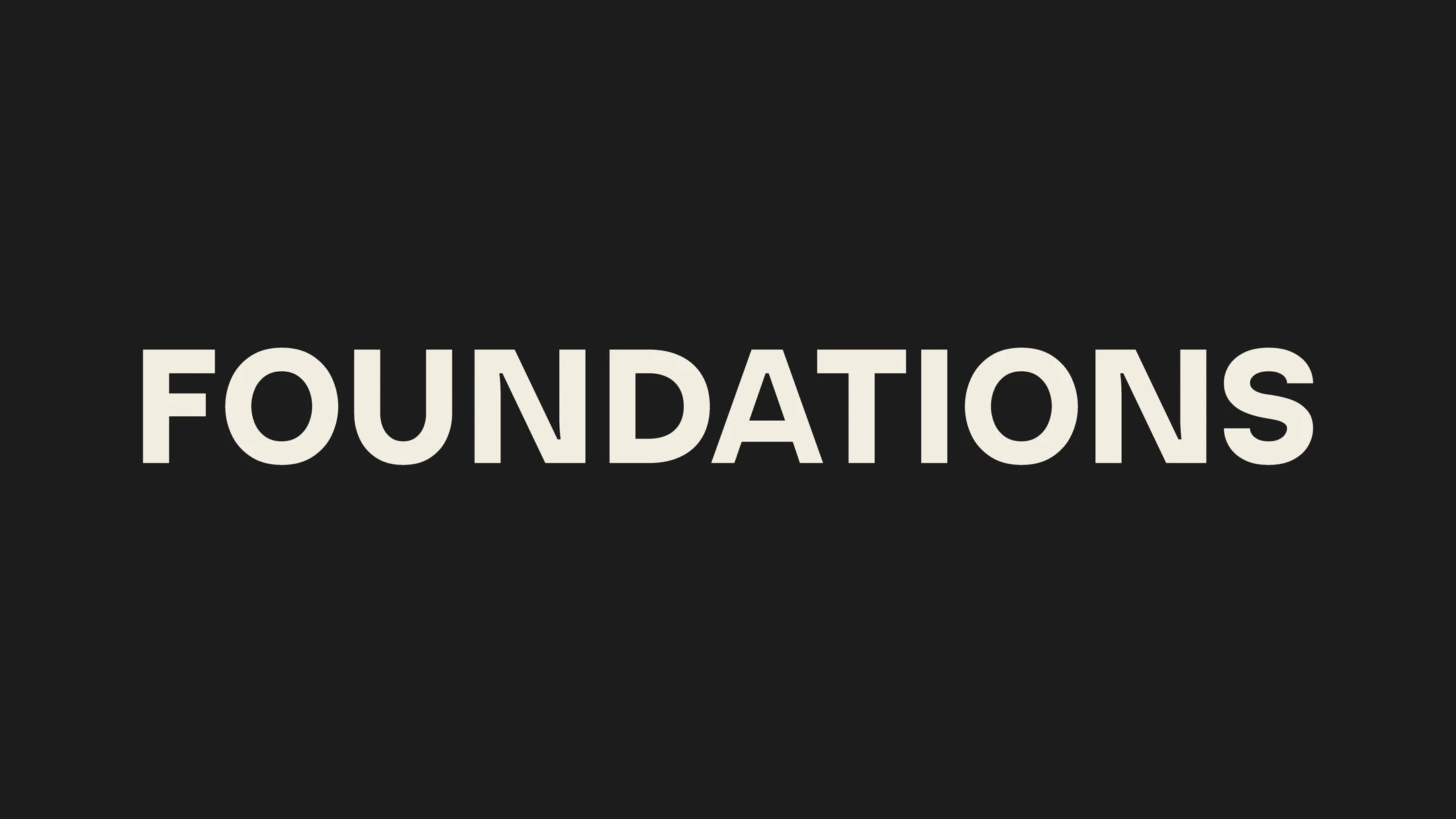 The word FOUNDATIONS in a bold, off-white, sans-serif font, centered horizontally on a solid black background.