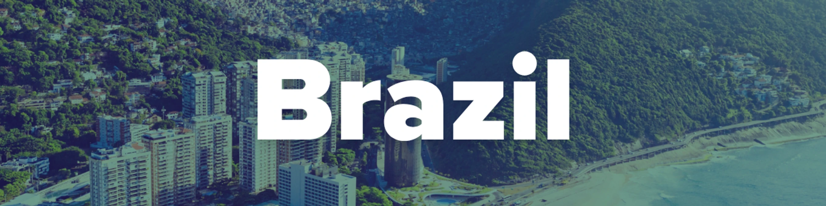 The word Brazil in bold white font over a blue-tinted aerial photo of a city between lush green mountains and the ocean, showing buildings and a coastline.
