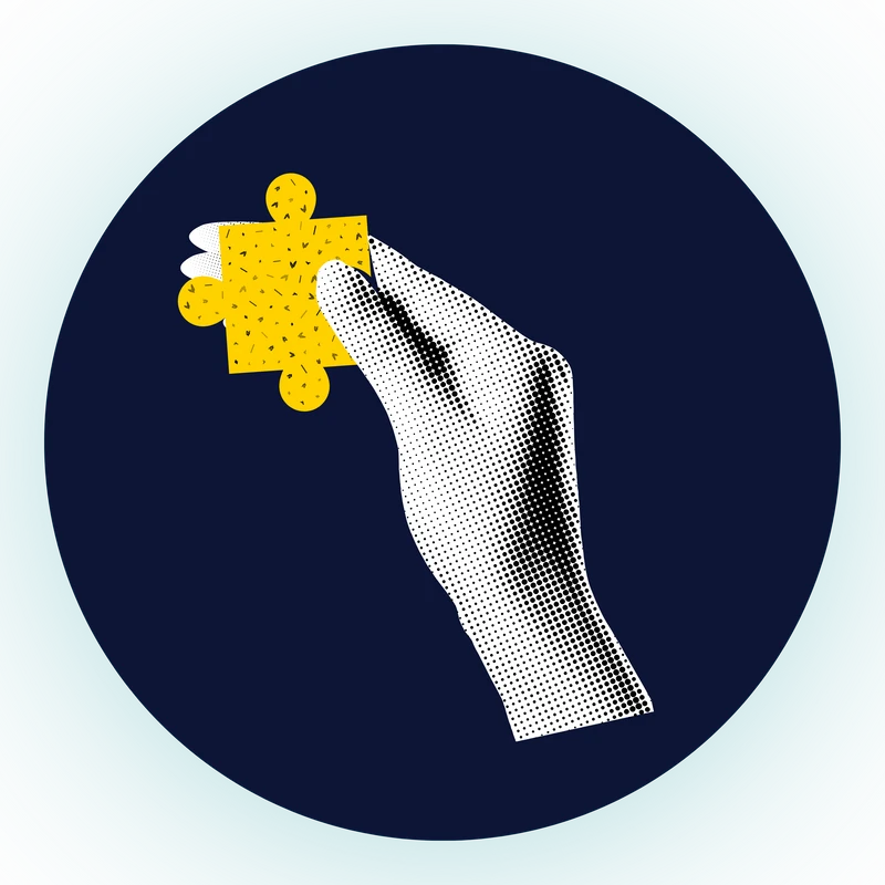 A graphic icon showing a hand in a halftone pattern holding a yellow jigsaw puzzle piece against a dark blue circular background.