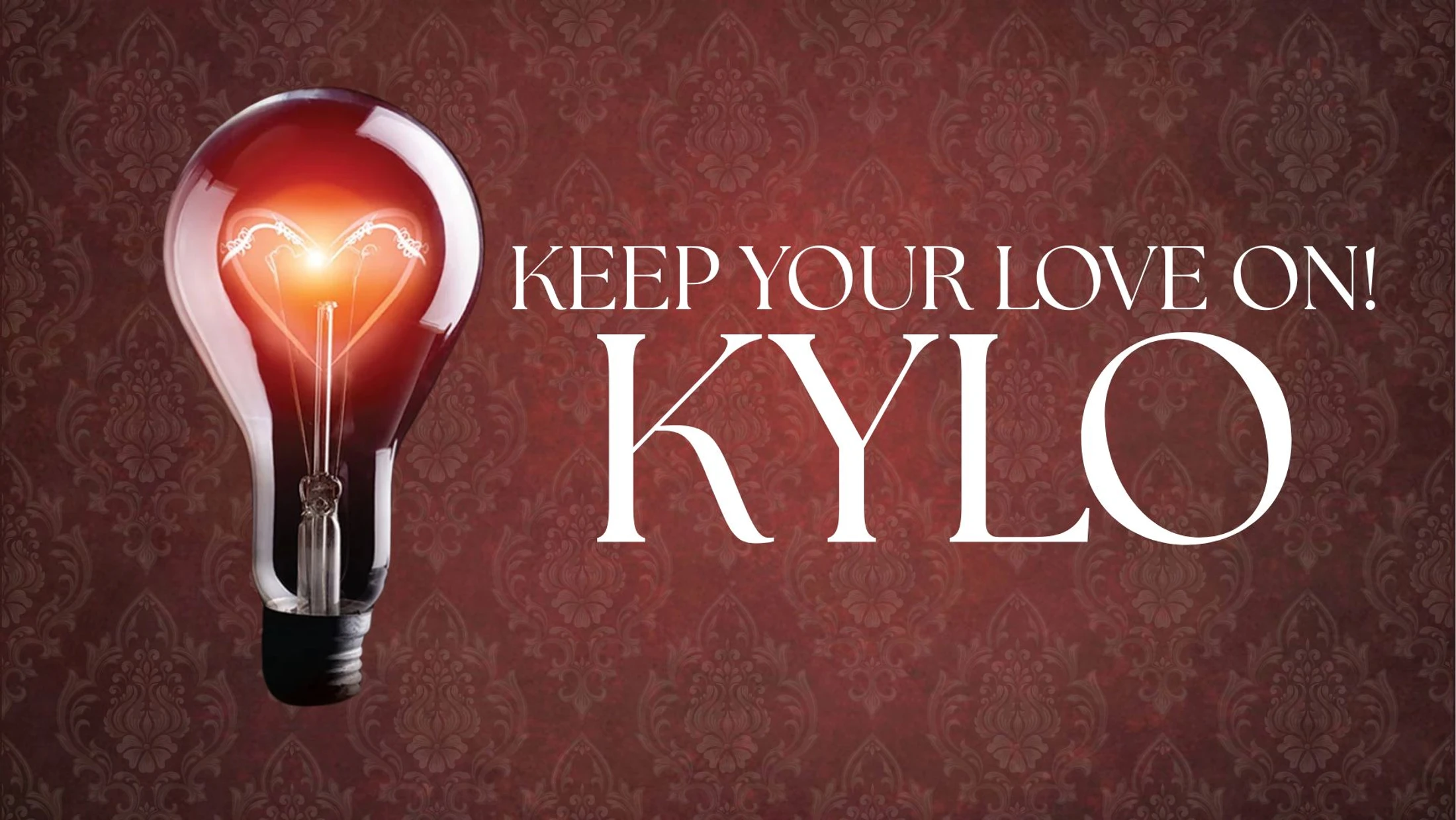 A glowing lightbulb with a heart-shaped filament next to white text that reads "Keep Your Love On! KYLO" on a red damask background.