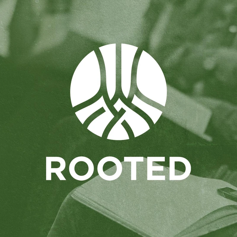 The word 'Rooted' under a white circular logo with an abstract root design, set on a textured green background showing people in a study group.