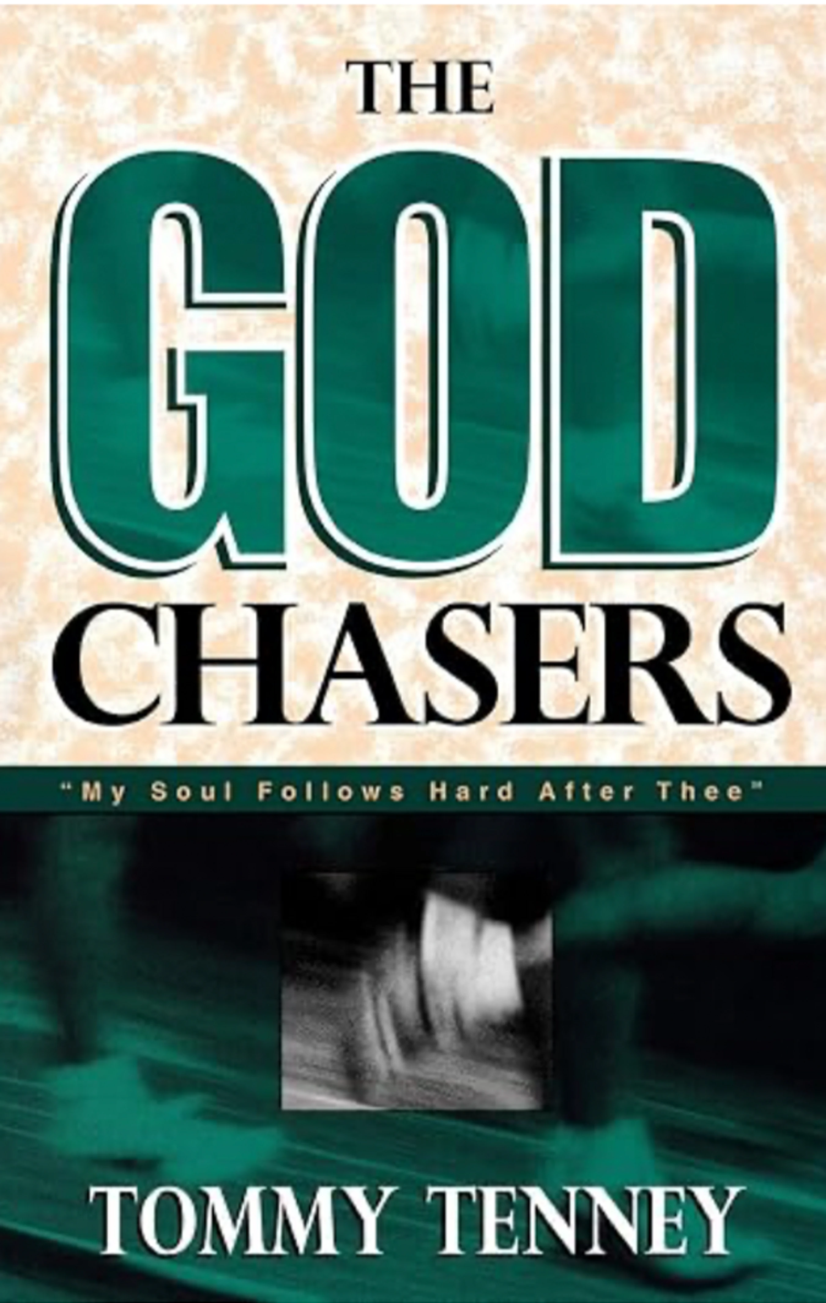 The book cover for 'The God Chasers' by Tommy Tenney, with the title in large green and black text over a textured beige and green background.