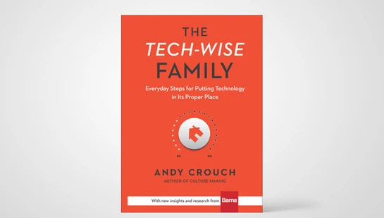 The orange cover of the book 'The Tech-Wise Family' by Andy Crouch, featuring a white control dial with a house icon in the center.
