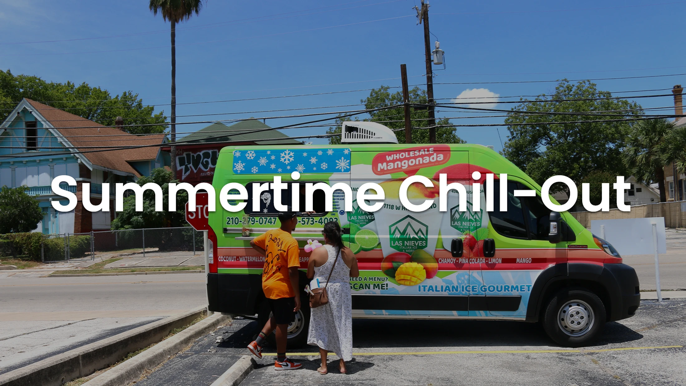 A couple orders from a colorful green and red Italian ice truck on a sunny summer day. The text 'Summertime Chill-Out' is overlaid on the image.