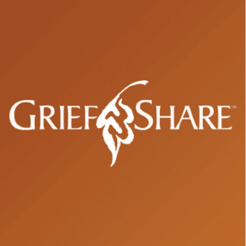 The white logo for GriefShare, a grief recovery support group. The text is separated by a stylized leaf graphic and set against a brownish-orange background.
