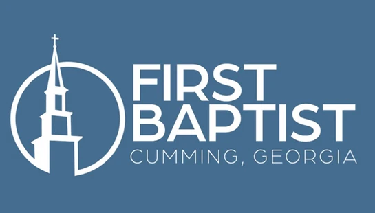 The logo for First Baptist church in Cumming, Georgia, featuring a white church steeple icon and text on a dusty blue background.