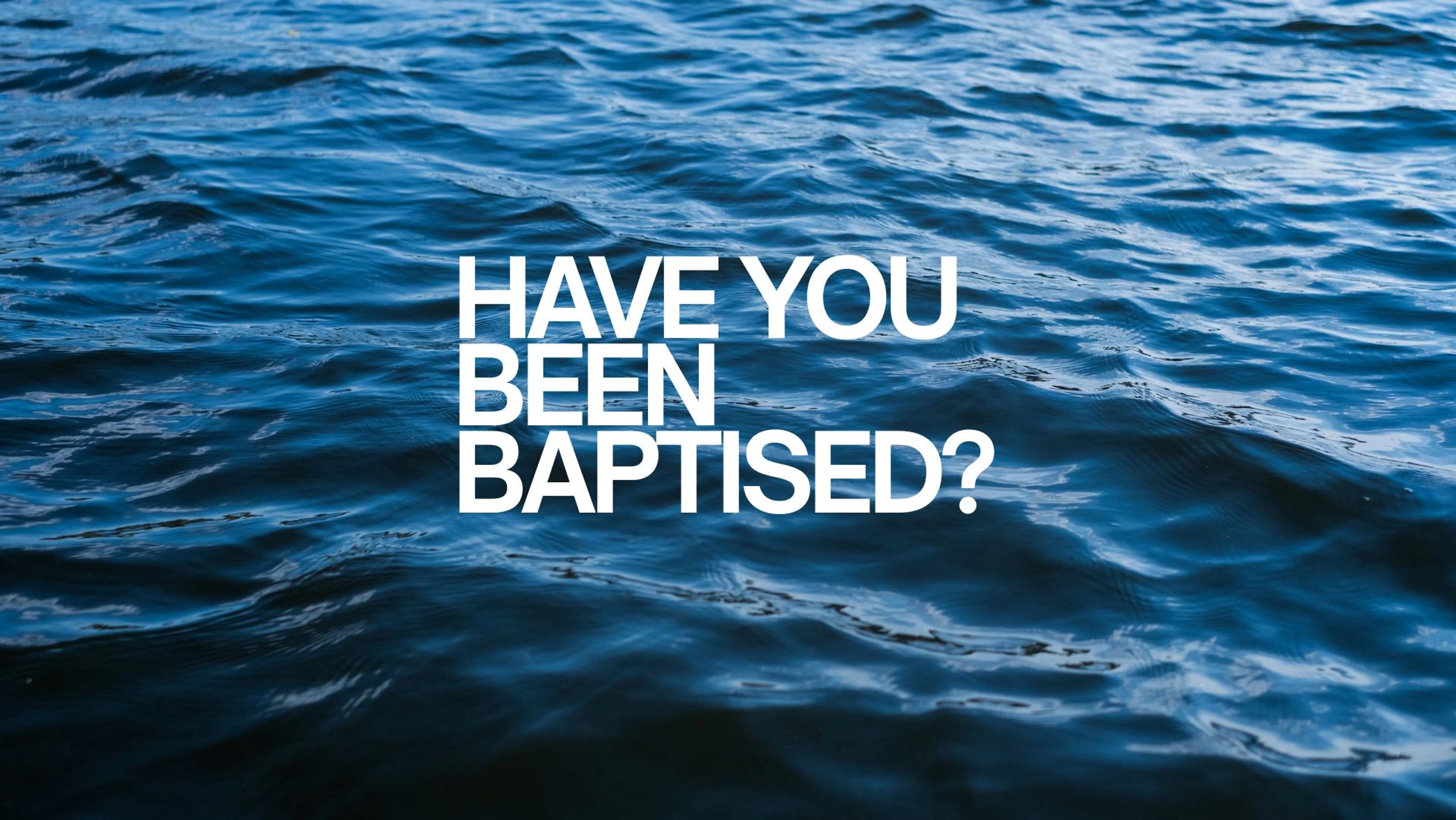 The question 'Have you been baptised?' in white text is layered over a photo of dark blue, rippling water.